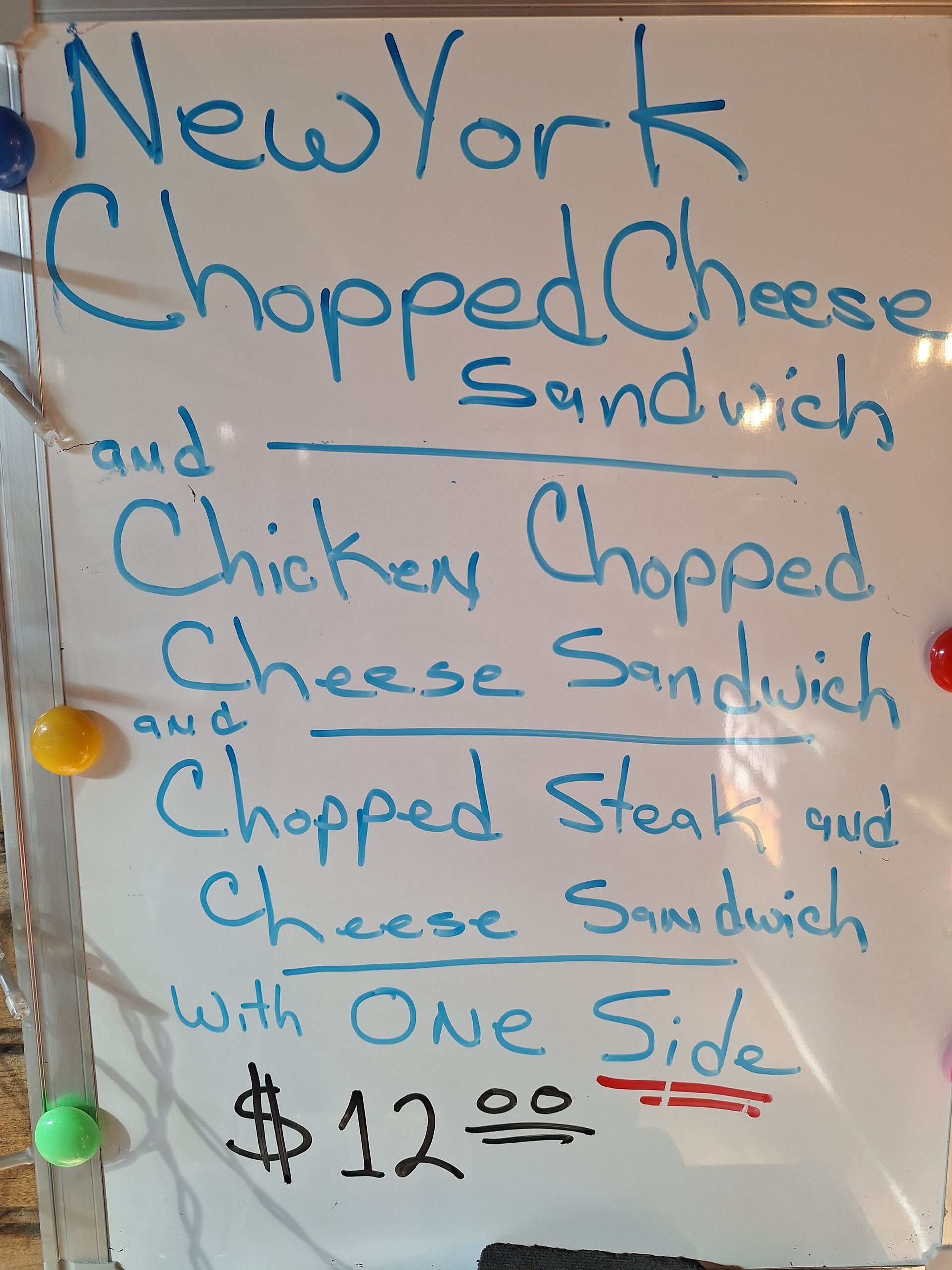 Whiteboard menu: New York chopped cheese sandwich, chicken chopped cheese, chopped steak and cheese with one side, $12.
