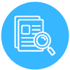 A magnifying glass is looking at a stack of papers.