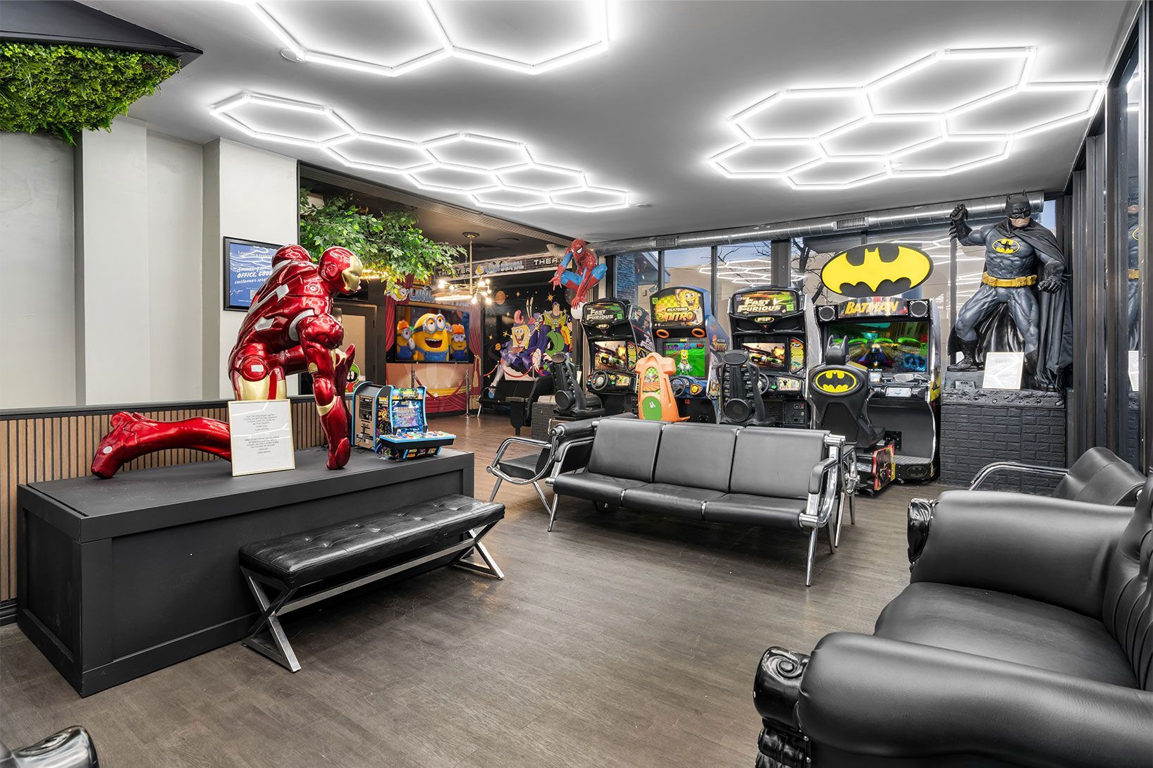 Bright indoor showroom with modern chairs, red decor, and large ceiling lights