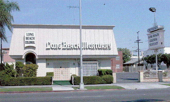 Exterior view of Long Beach Mortuary building with signage.
