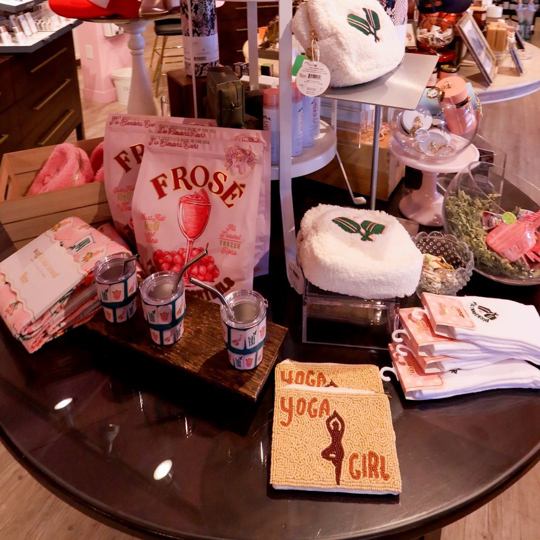 Gift display at Splendor in Park City with Frose mixes, tumblers, plush pouches and a Yoga Girl mat.
