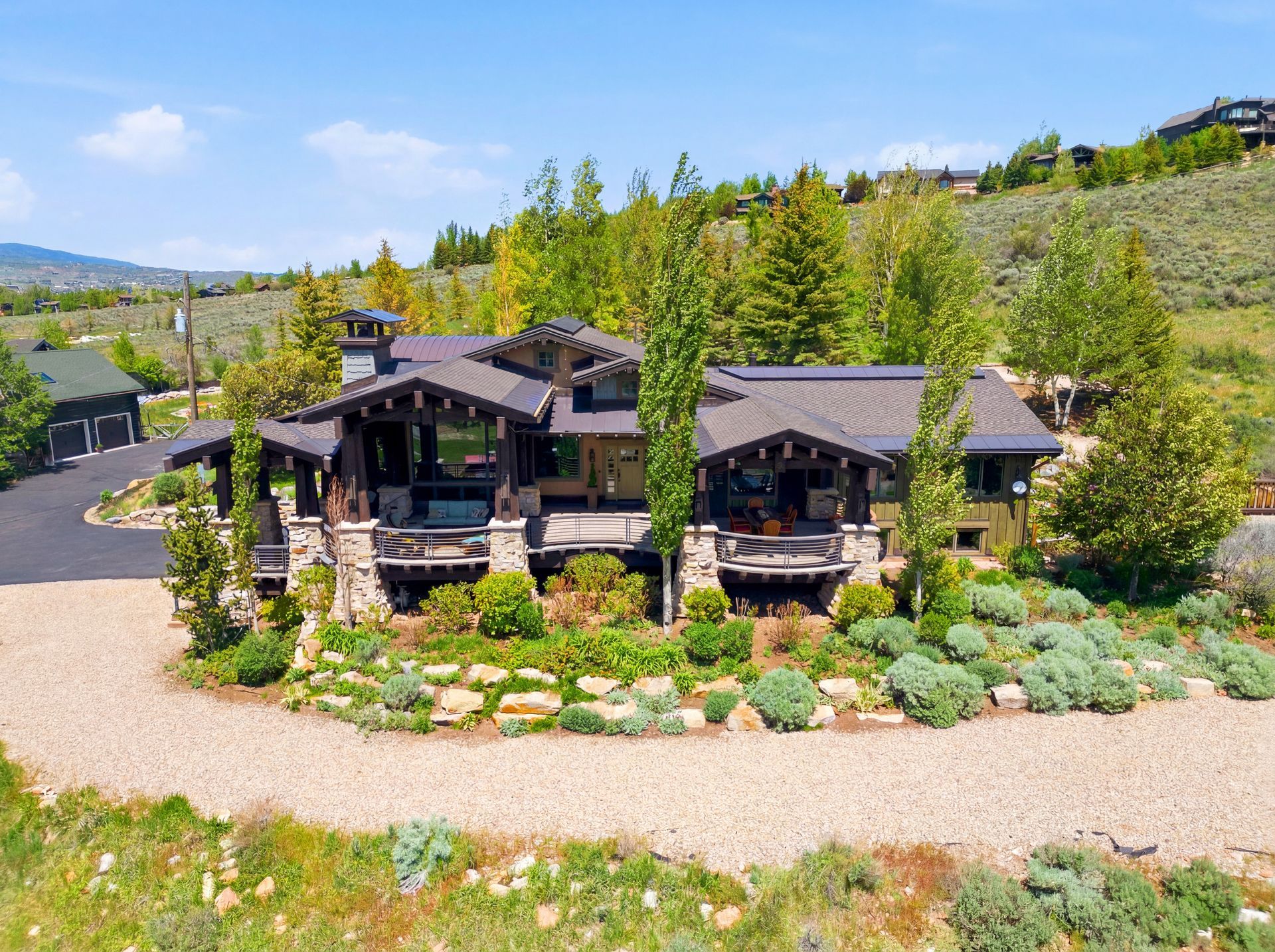 Aerial view of the front exterior and driveway of this luxury Old Ranch Road estate in Park City, Utah.