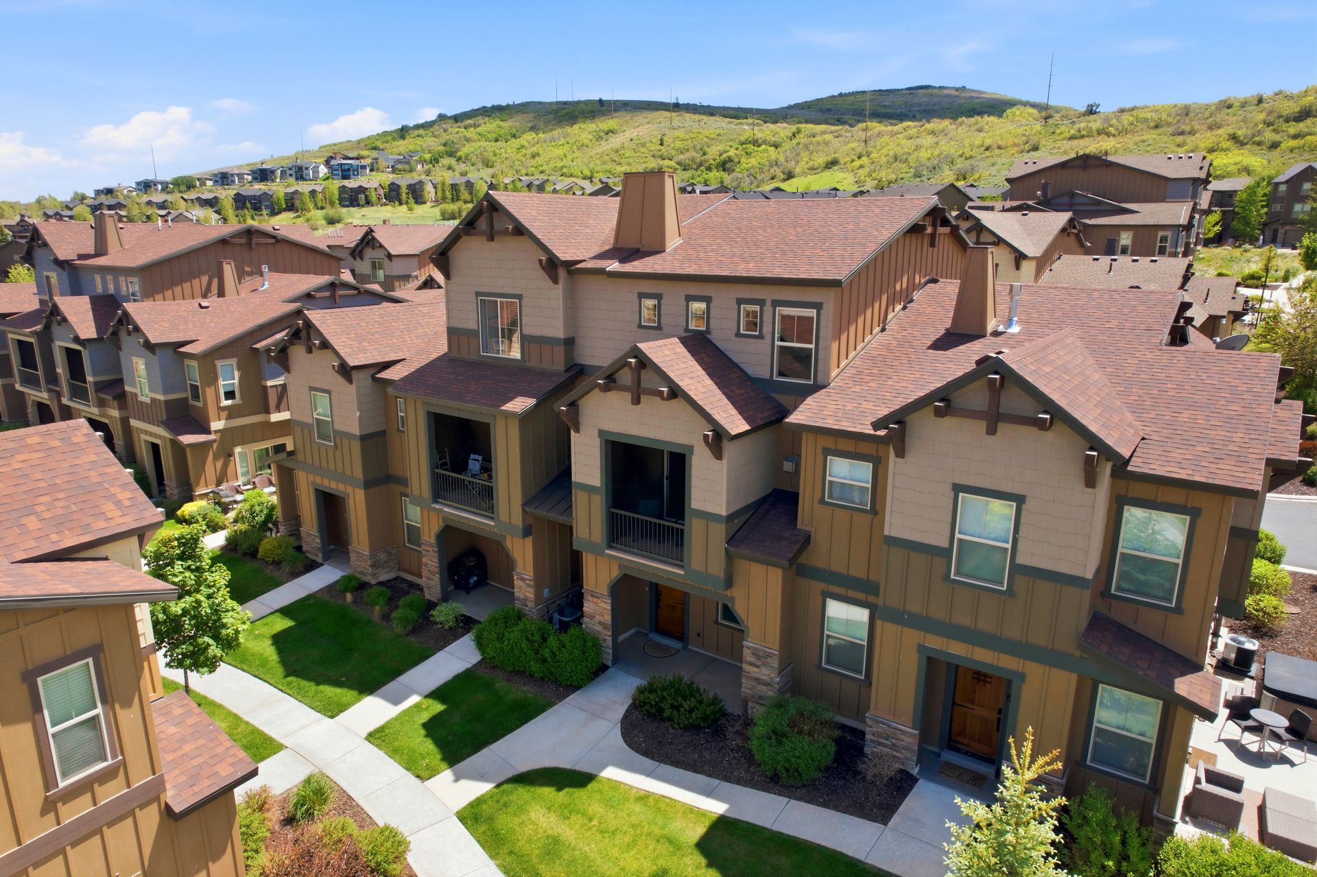 Exterior front view of the luxury townhome at 13608 N Hillclimb Lane in the Park's Edge community, Heber City, Utah.