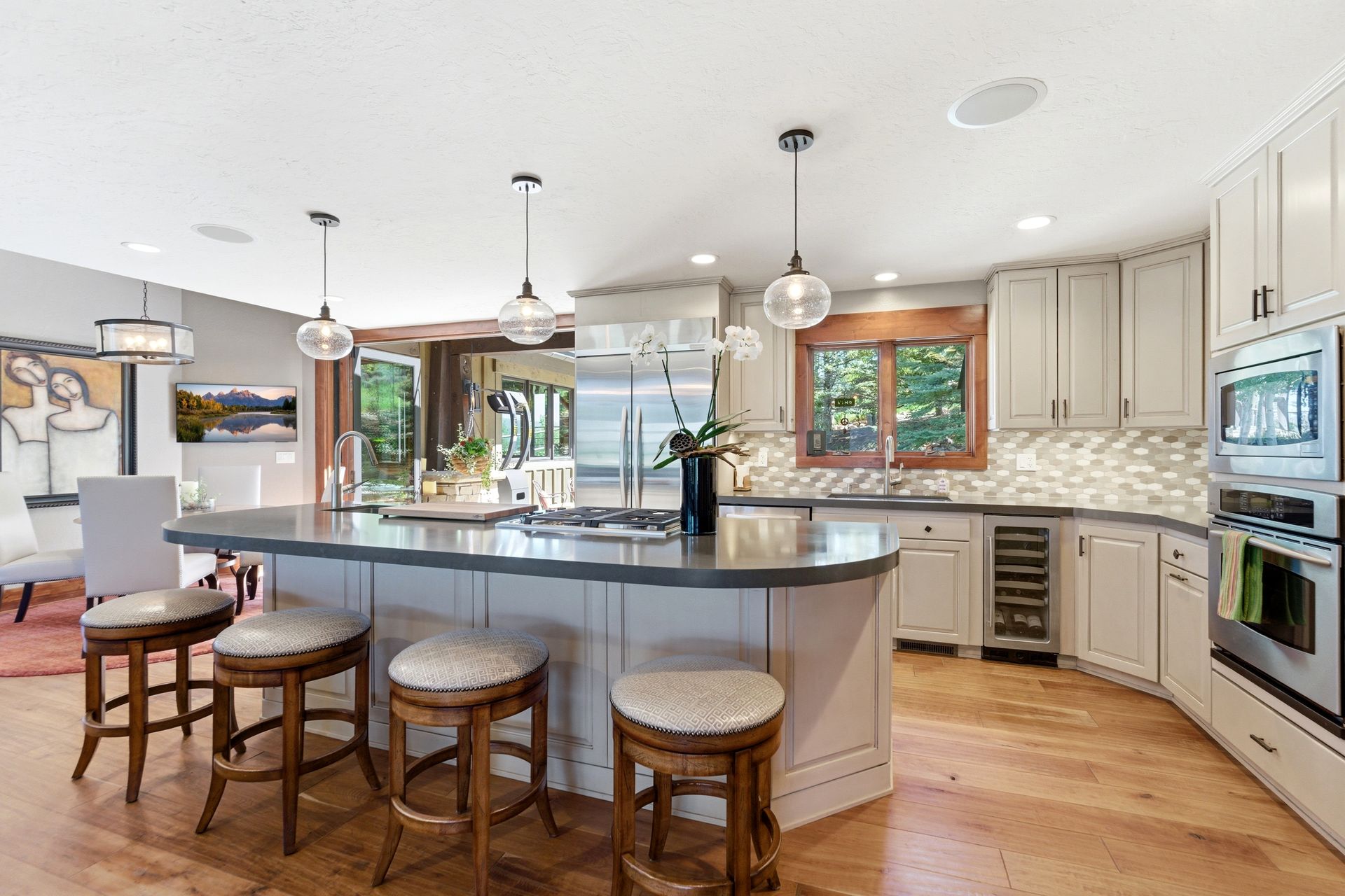 Gourmet open-concept kitchen featuring a large island, custom cabinetry, and premium appliances in a Park City luxury estate.
