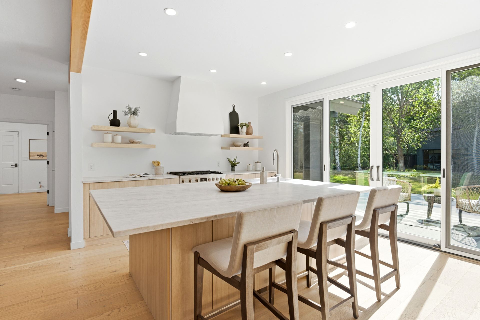 Premium remodeled chef's kitchen featuring quartzite countertops, a large center island, and a Bosch appliance suite.