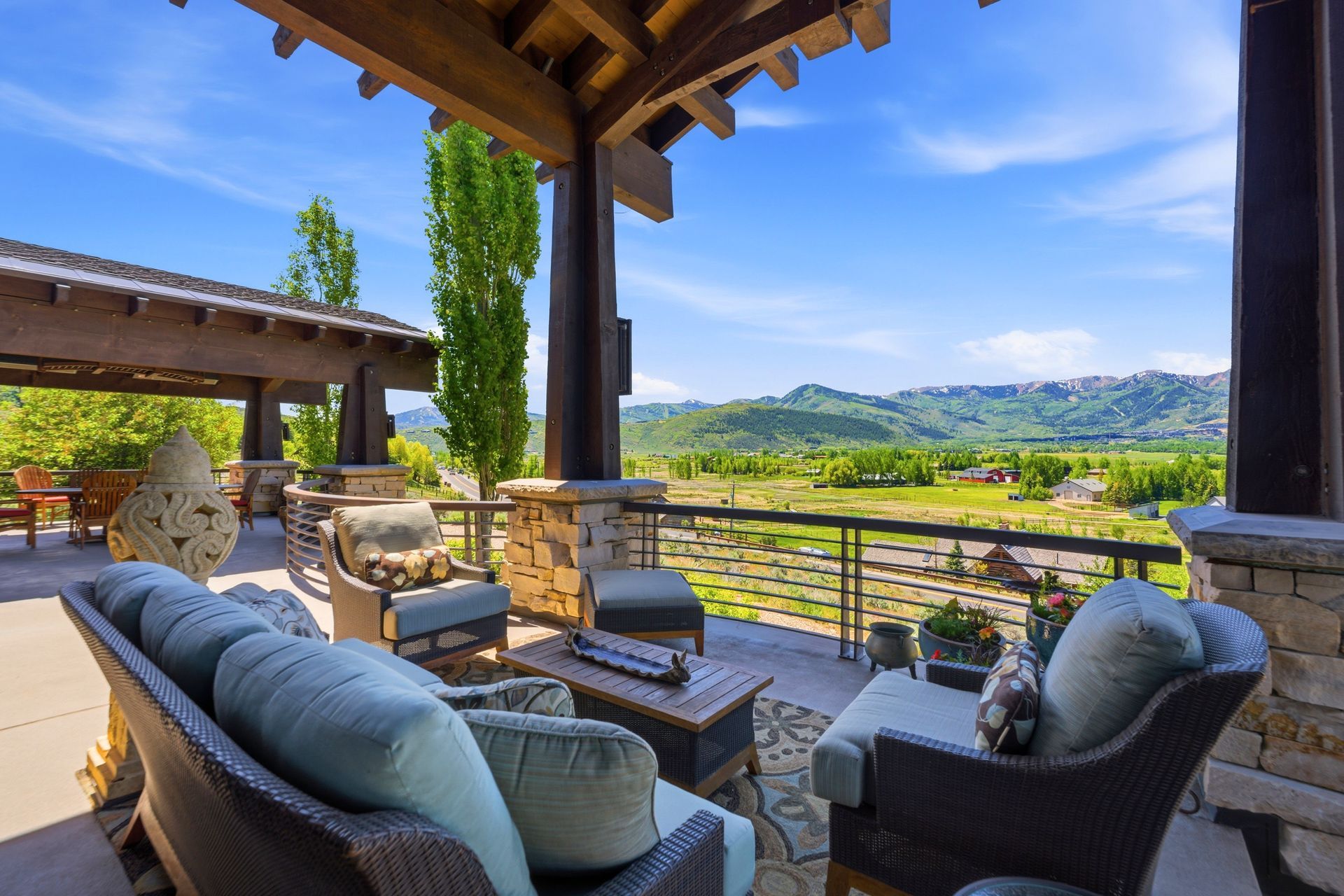 Comfortable outdoor seating and entertainment area on the spacious deck of a luxury Park City mountain retreat.