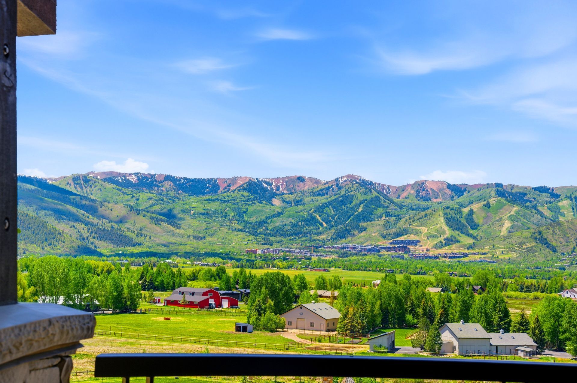 Expansive outdoor deck offering panoramic mountain and Swaner Preserve views at this Old Ranch Road luxury home in Park City, Utah.