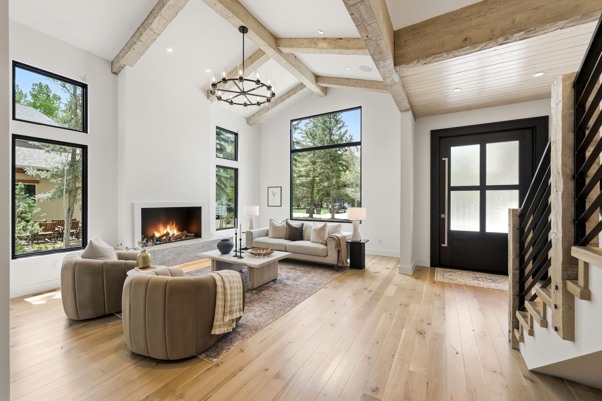 Expansive open-concept great room with custom white oak flooring in a Silver Springs modern farmhouse.