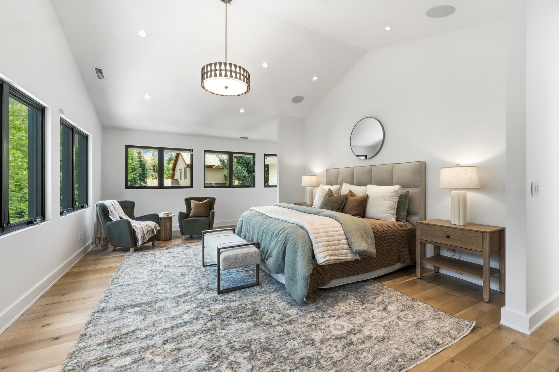 Luxurious main-level primary suite featuring elegant design and vaulted ceilings at 5272 Heather Lane.