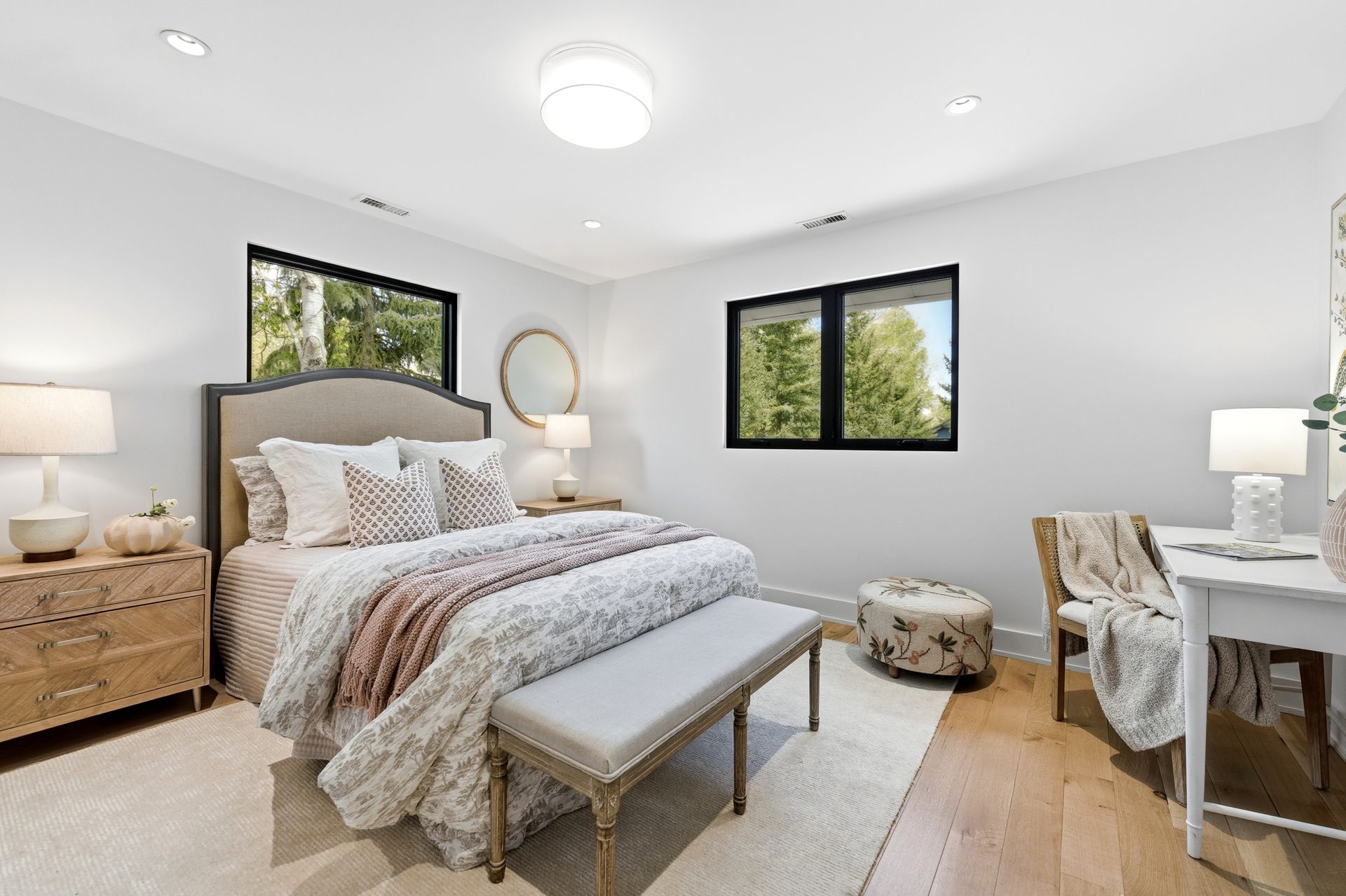 Bright upper-level guest bedroom featuring custom white oak flooring and modern finishes at 5272 Heather Lane.
