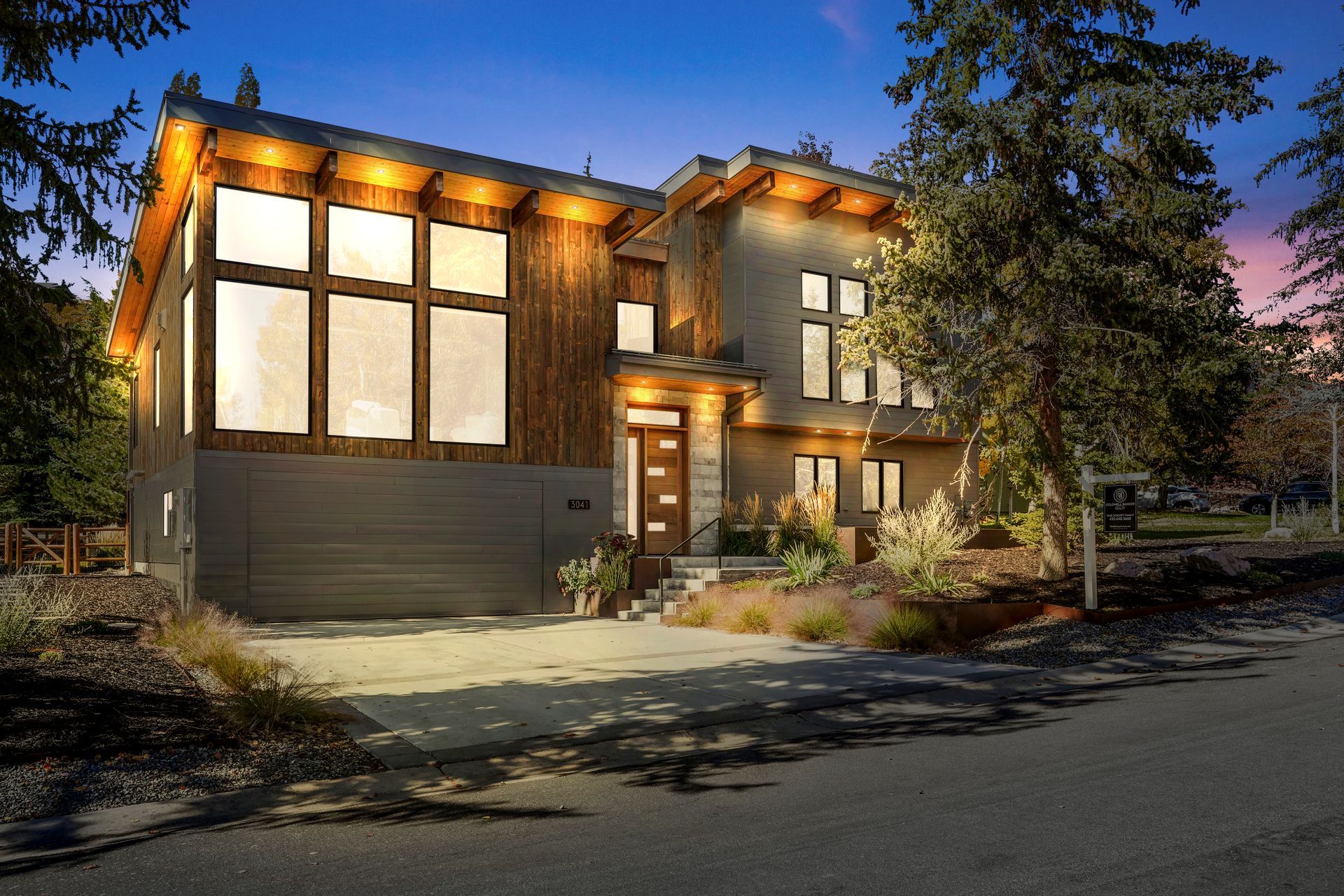 Exterior of a luxury mountain home on Oak Rim in Park City at twilight, showcasing premium Park City real estate.