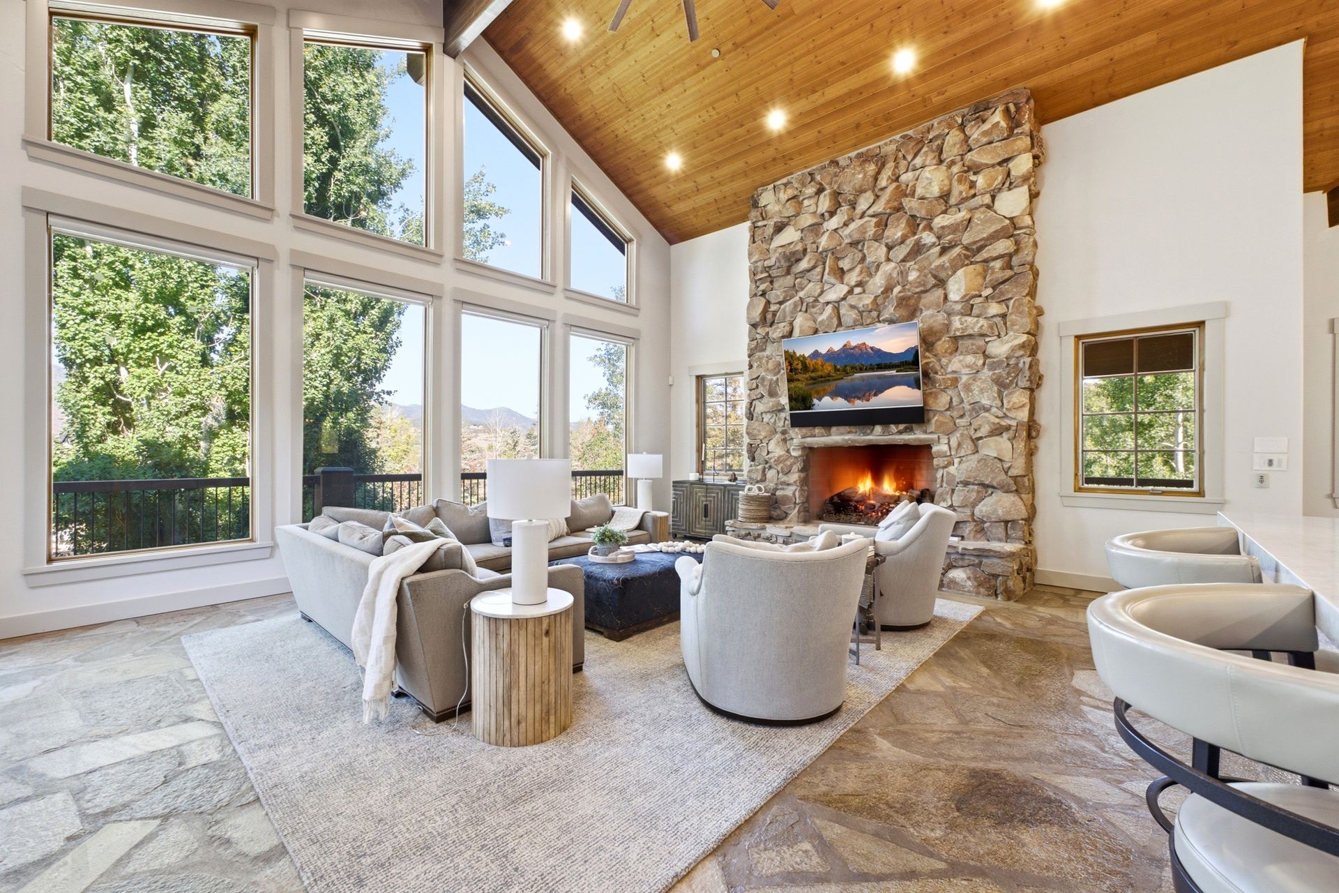 Floor-to-ceiling windows in the great room framing unobstructed views of the Wasatch Back mountains.
