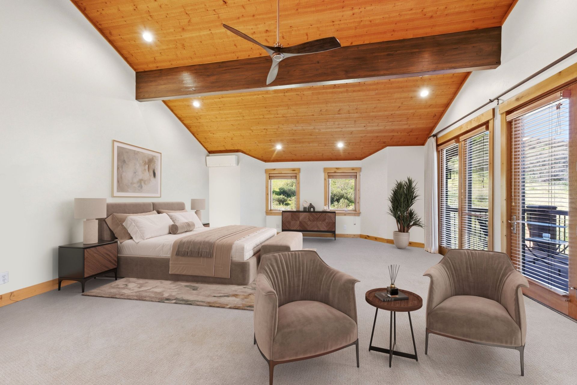 Virtually staged primary suite at 2490 Silver Cloud Dr with upholstered bed, sitting area, and vaulted wood ceiling