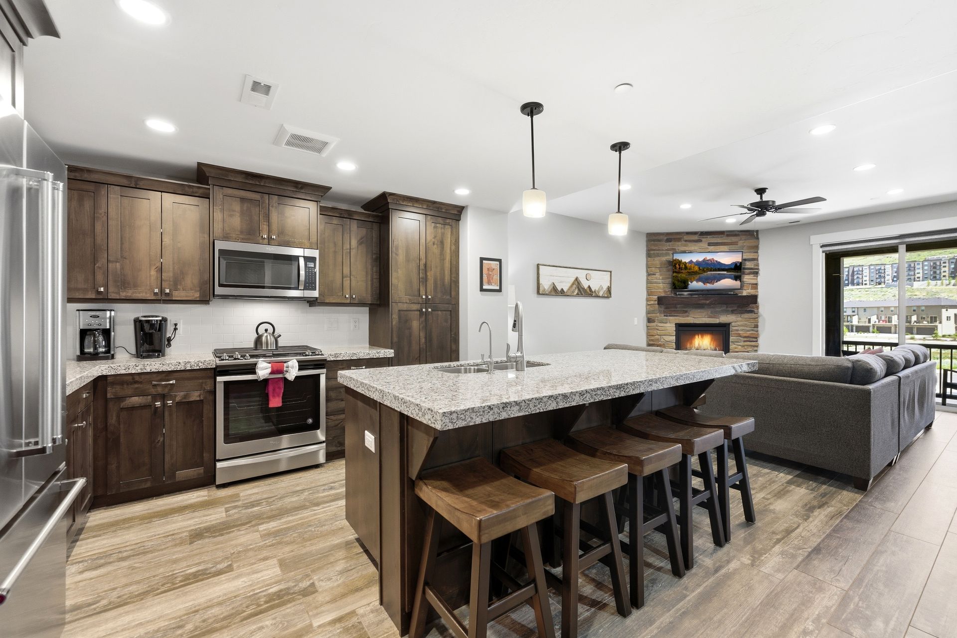 Bright open-concept kitchen and living area in the Park's Edge community townhome at 13608 N Hillclimb Lane, Heber City.