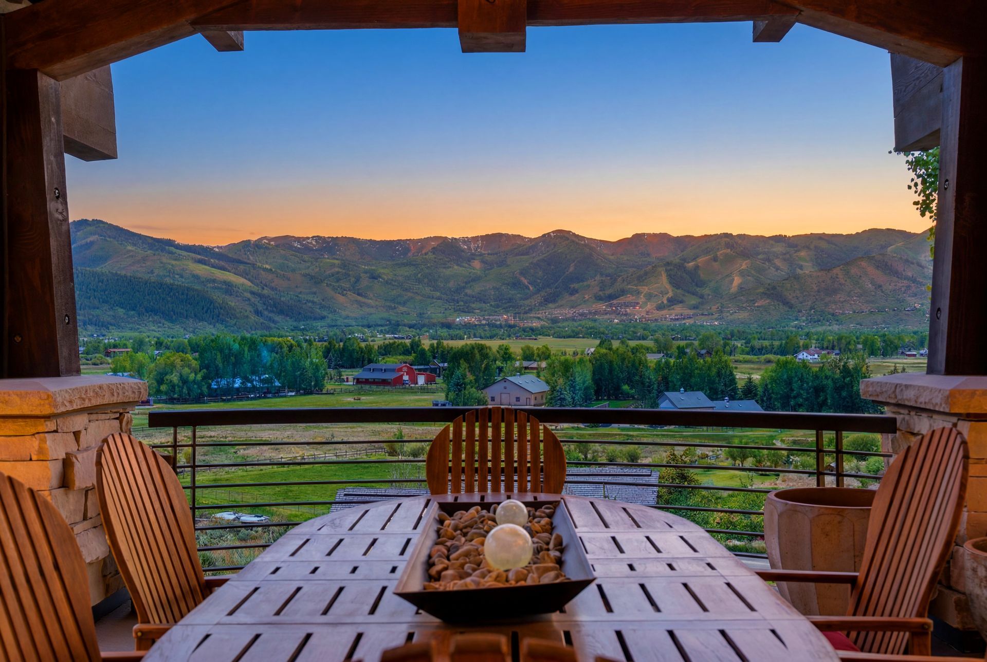 Stunning sunset view over the Swaner Preserve from the front deck of this luxury Old Ranch Road estate in Park City.