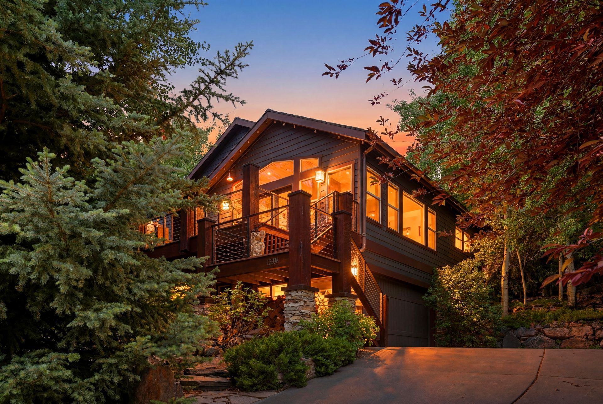 Stunning twilight exterior of the extensively remodeled luxury home at 12384 N Ross Creek Drive in Kamas, Utah.