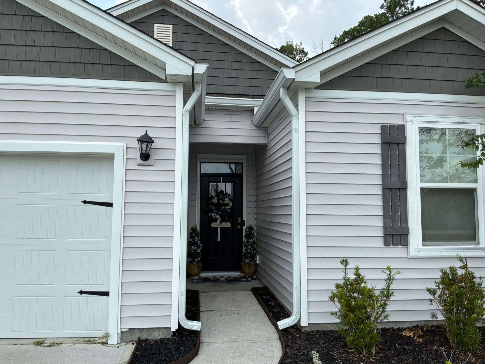 Clear gutter run and downspout after a seasonal cleanout by Charleston Roofs and Windows