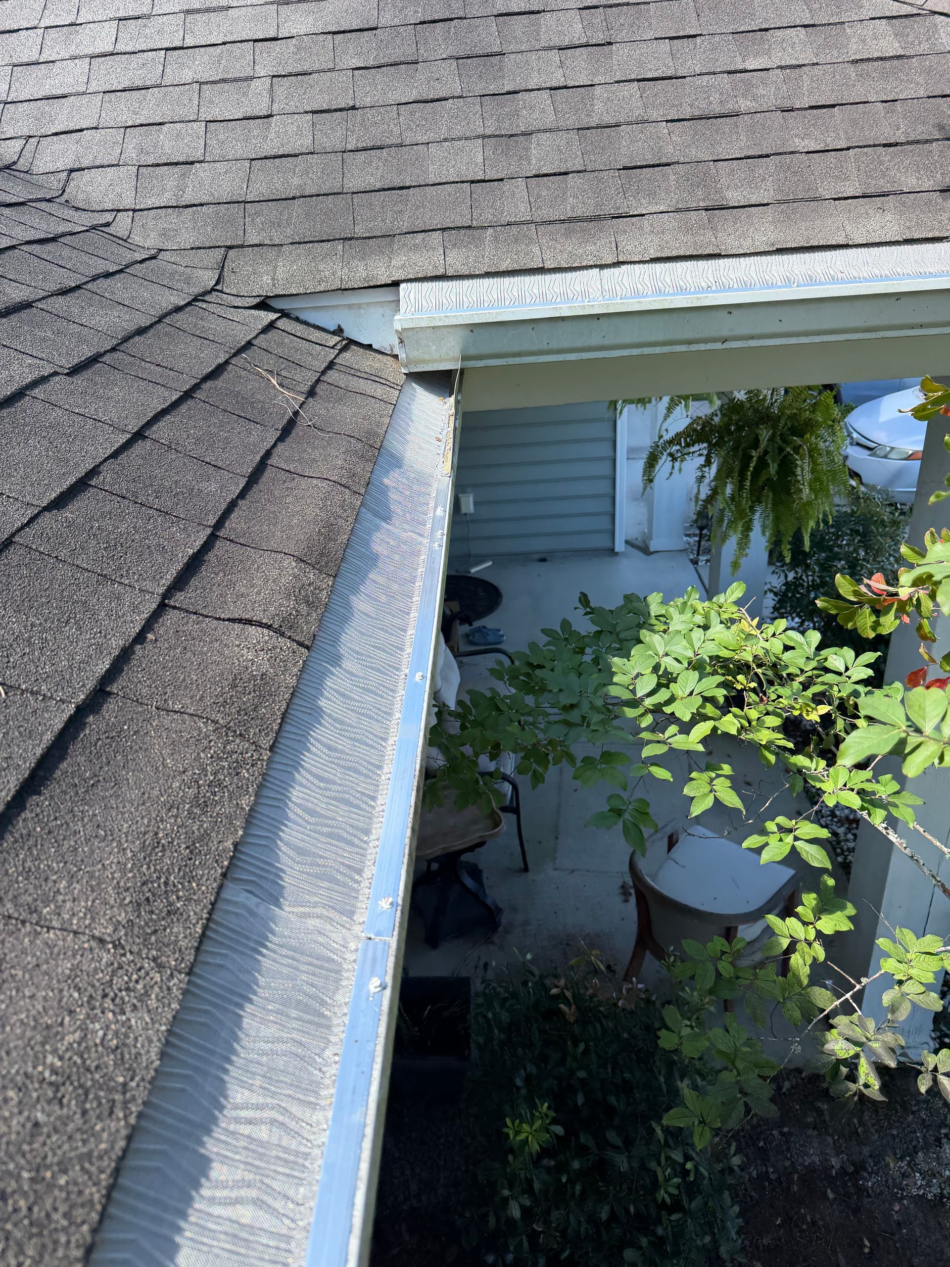 Finished seamless gutter run along the roofline of a Charleston home by Charleston Roofs and Windows