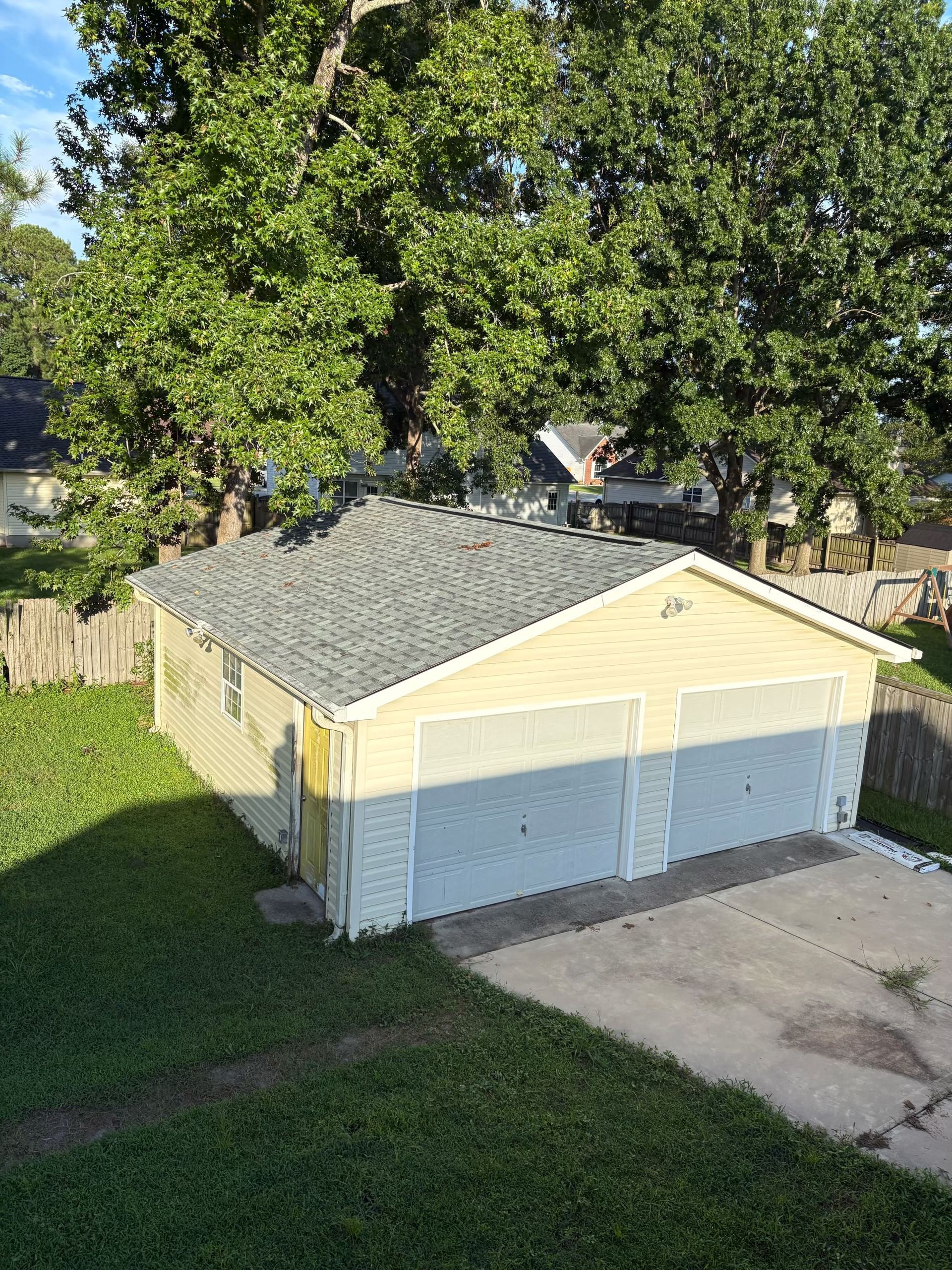 Aging shingle roof on a Lowcountry home assessed for repair or replacement by Charleston Roofs and Windows