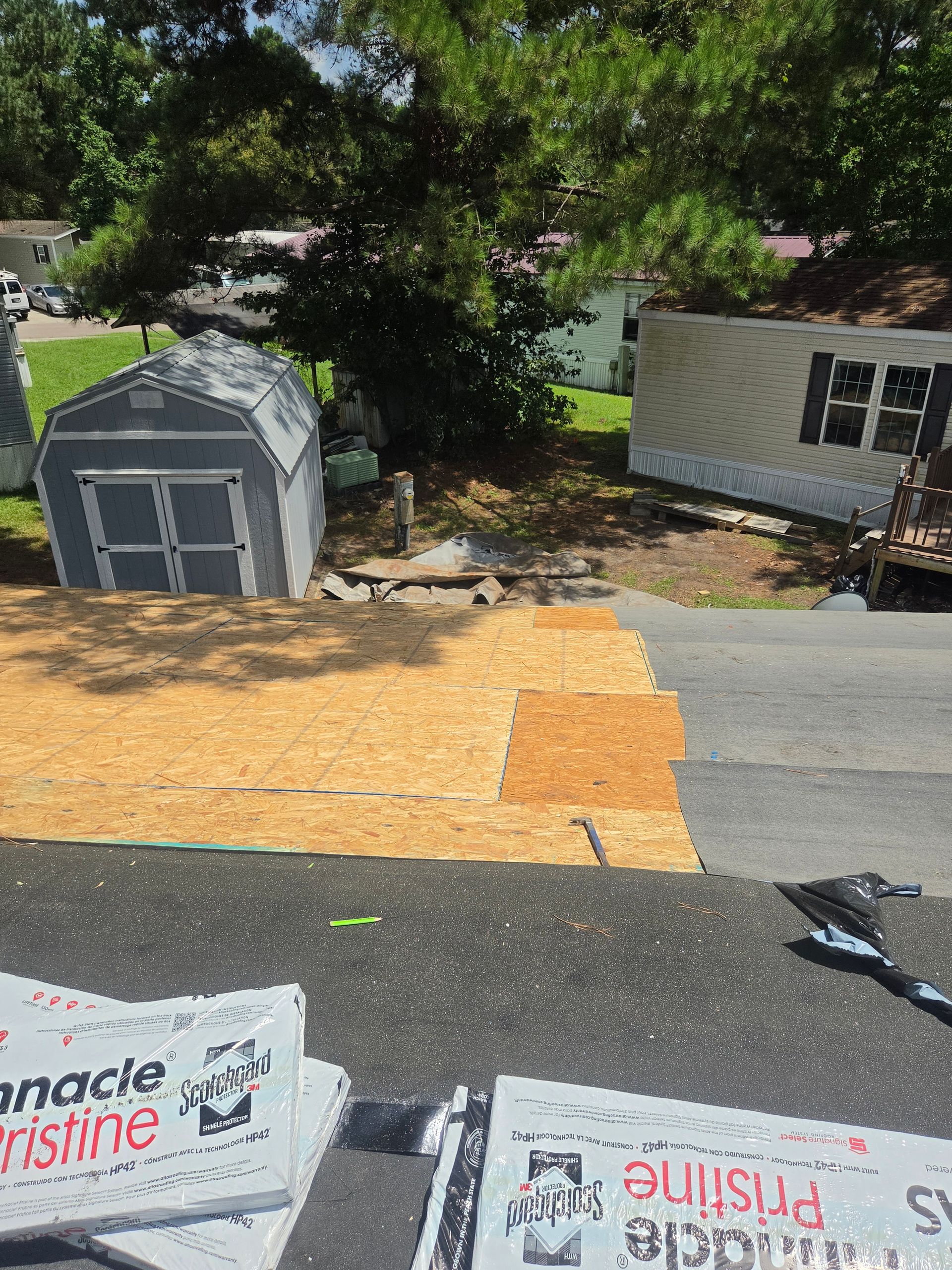 Inspection manager checking flashing and vents during a roof inspection