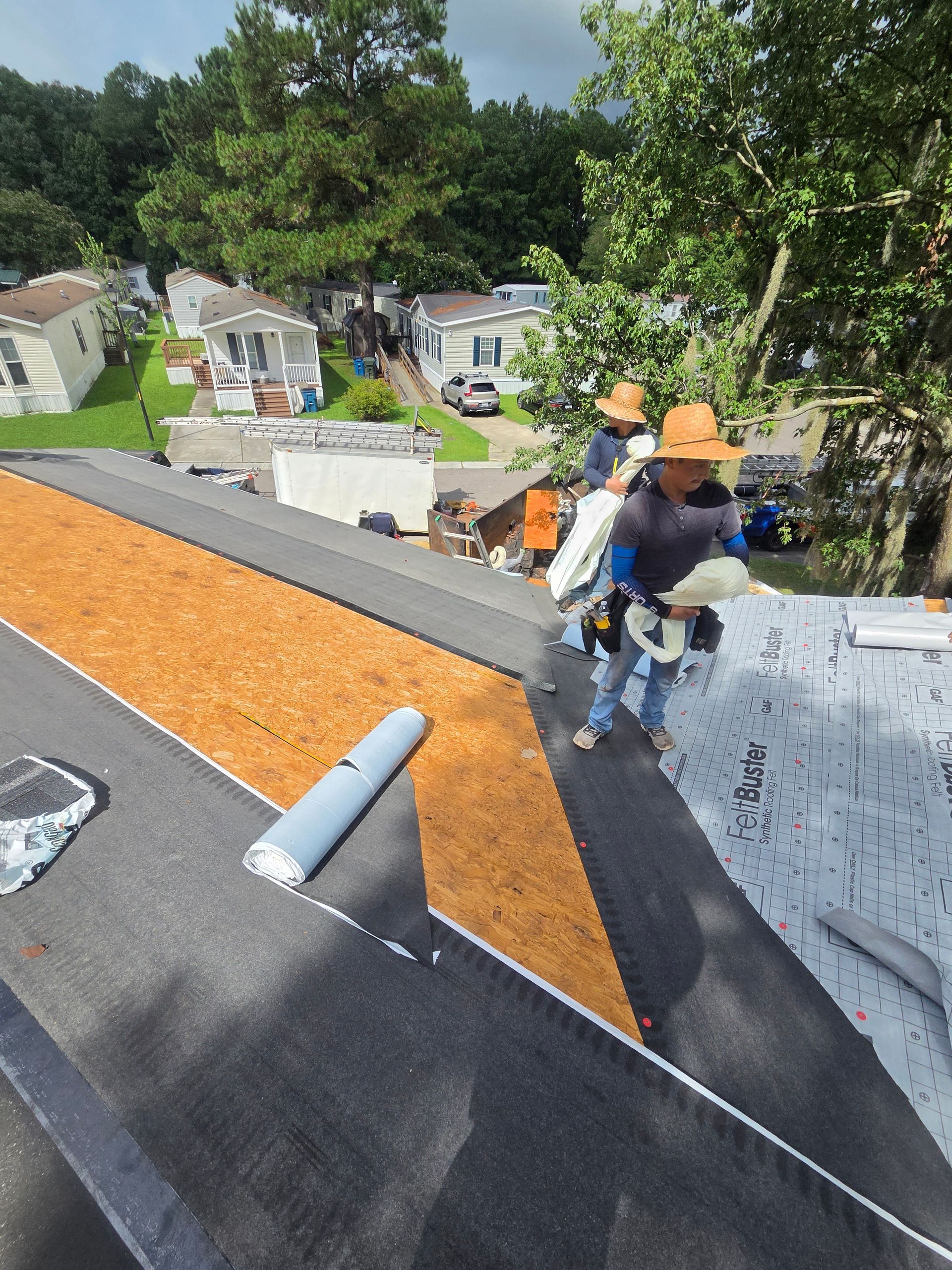 Roof replacement company near you inspecting attic decking before writing a replacement estimate