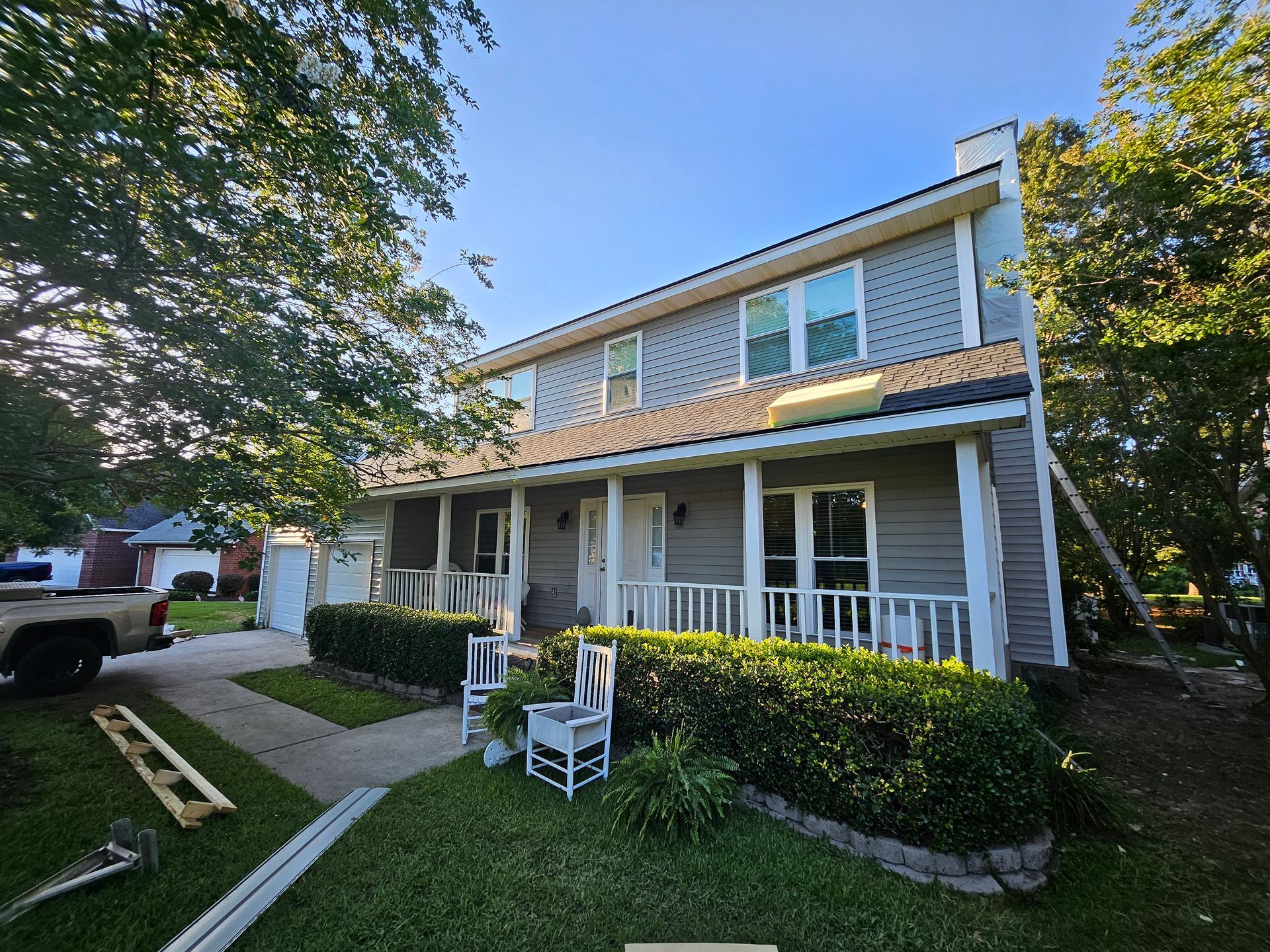 Charleston Roofs and Windows crew installing storm-resistant siding