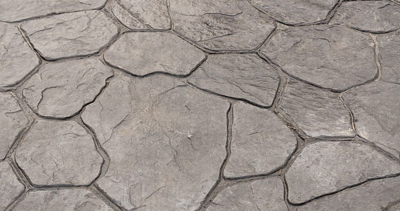 Stamped concrete (rounded stone-look) sidewalk