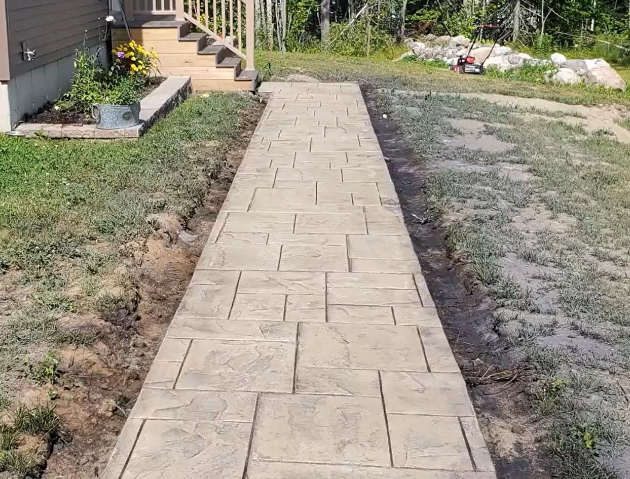 Newly completed, stamped and stained concrete sidewalk