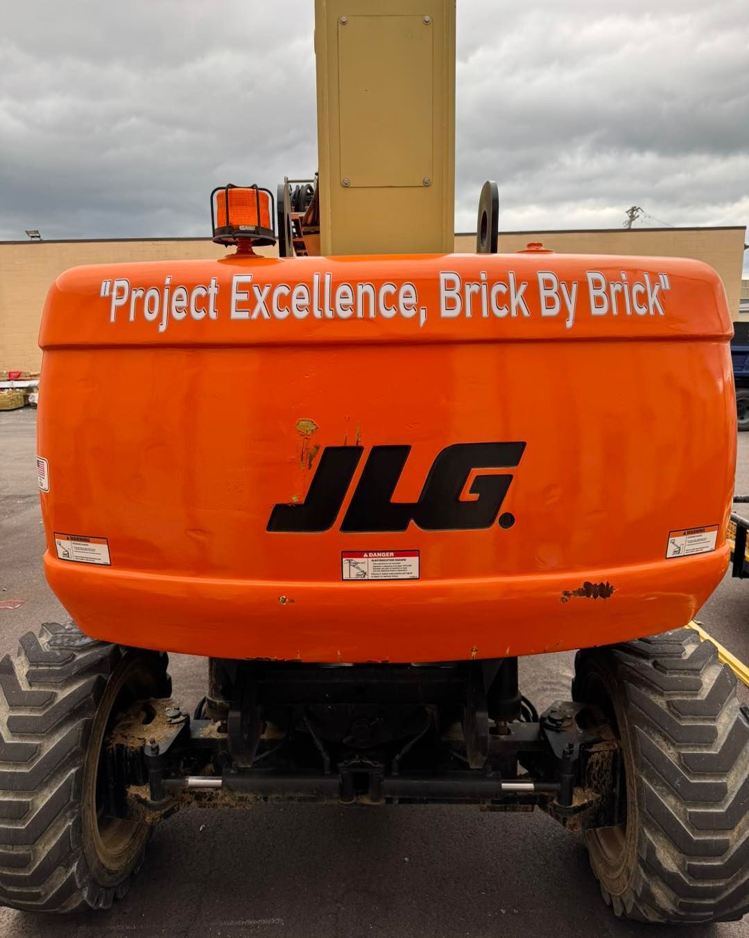 Orange JLG construction lift with