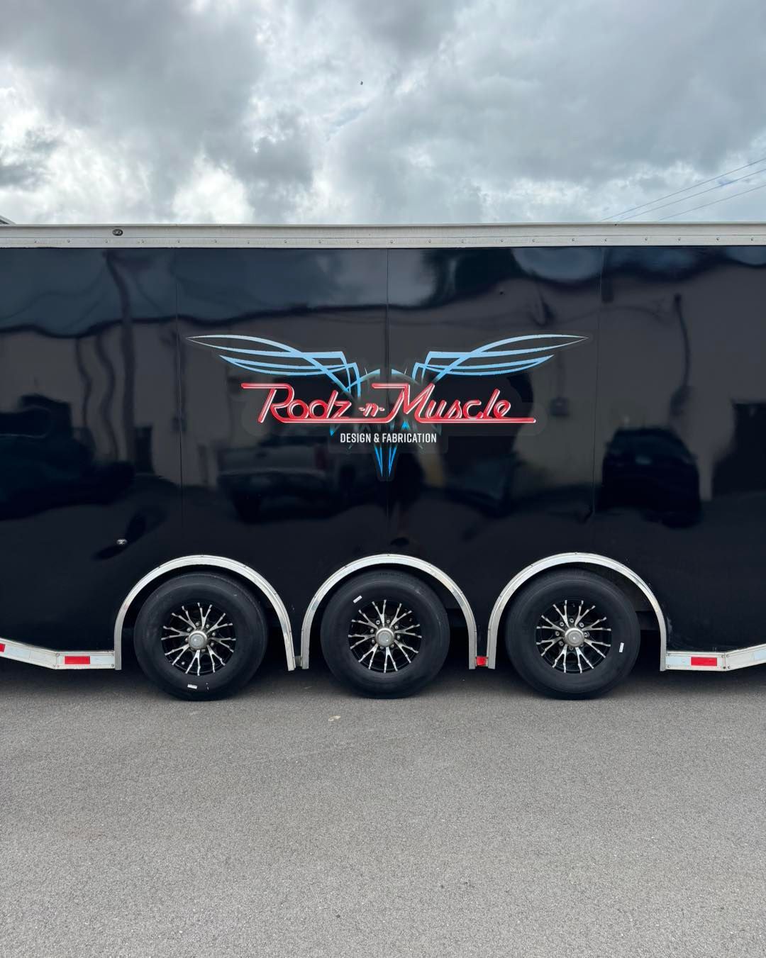 Black trailer with red
