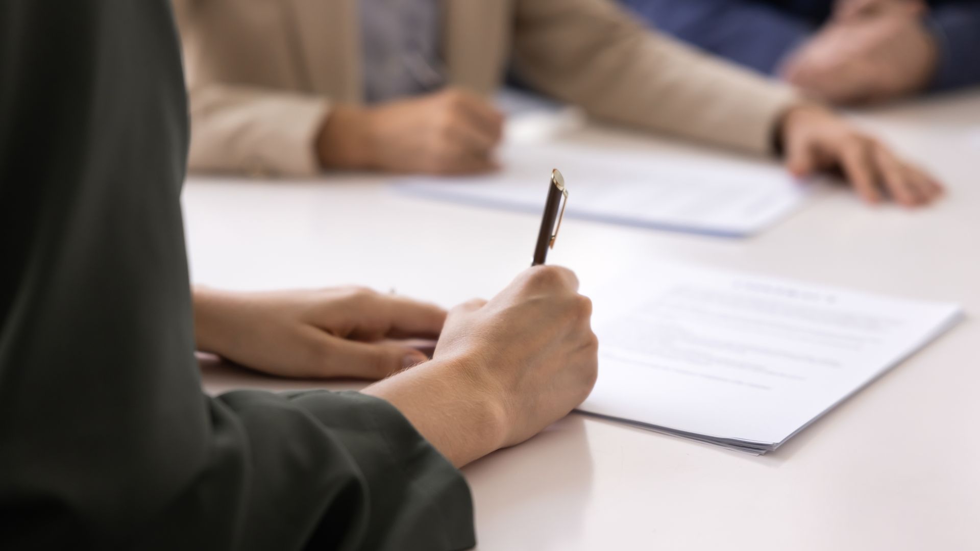 Loan business paperwork and pen on a desk during a lending consultation