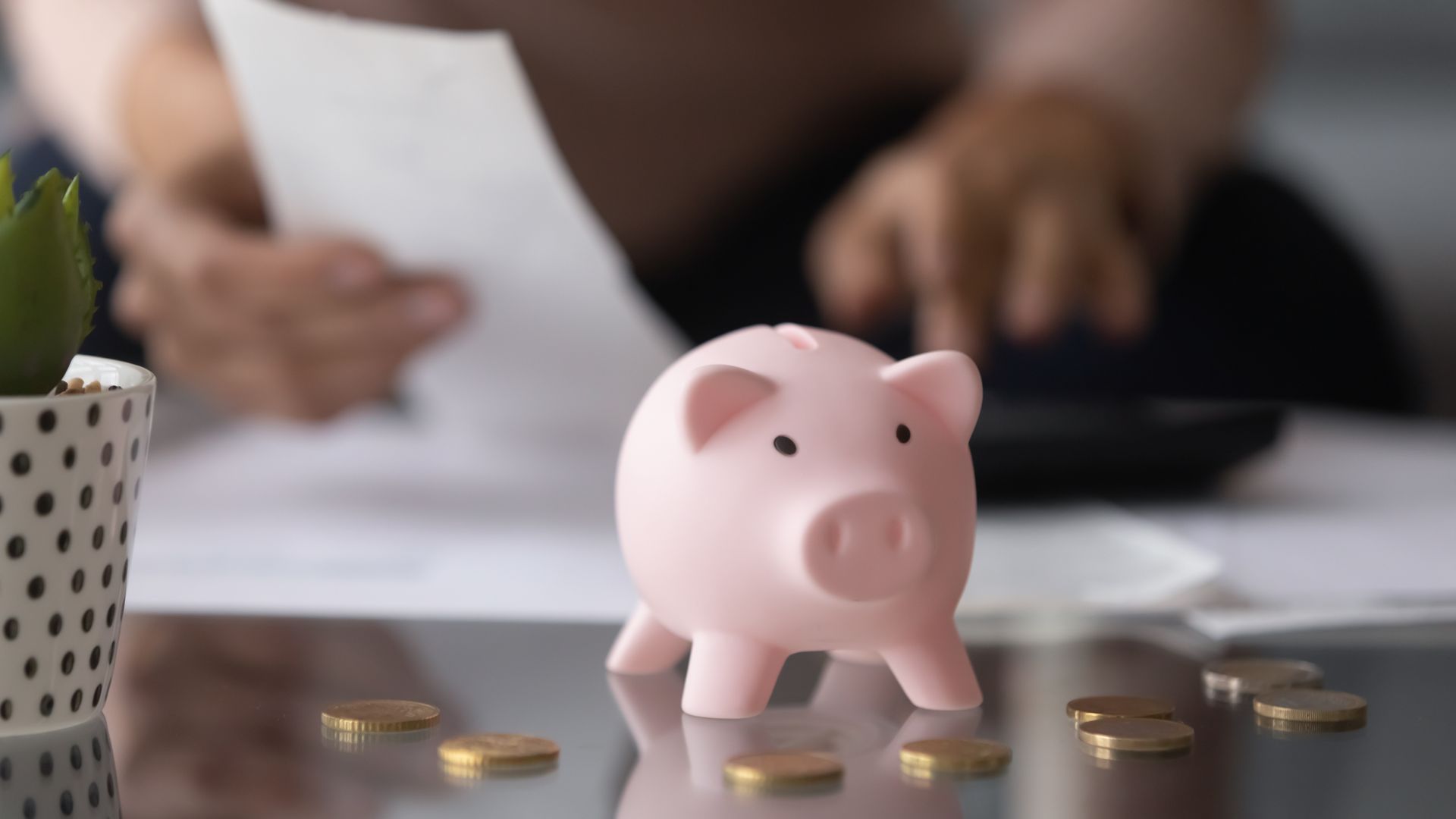 Close up focus on piggybank on table. Close up focus on piggybank on table.