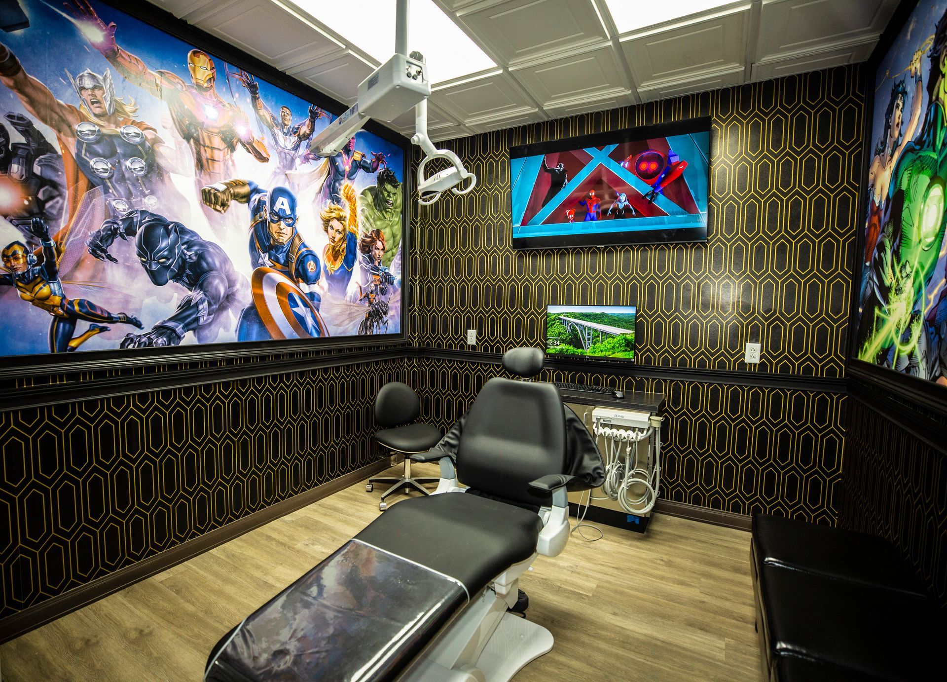 Super Dentists in San Antonio A dental office with a superhero mural on the wall and a dental chair.
