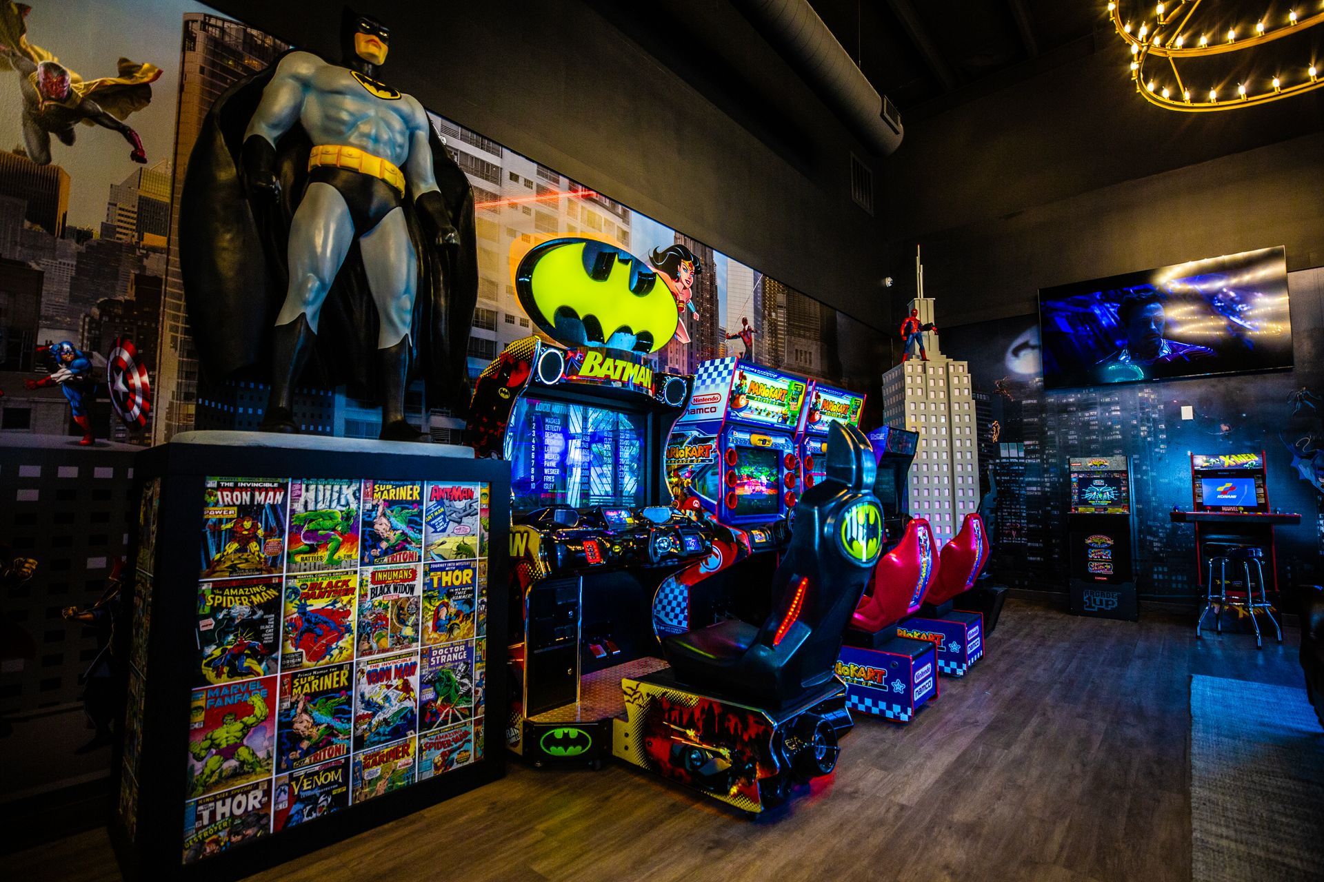 Super Dentists in San Antonio A room filled with lots of arcade games and a statue of batman.