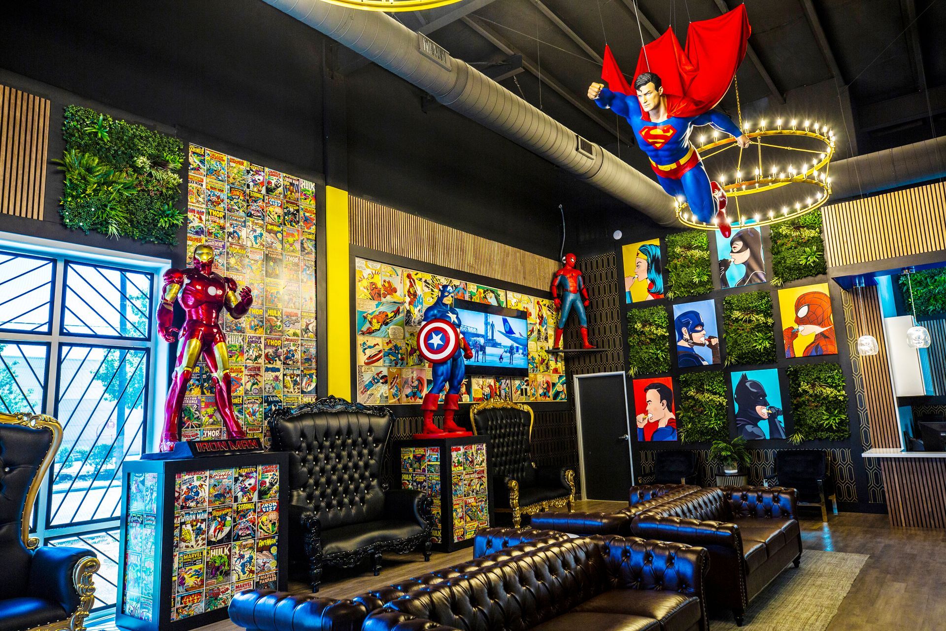 Super Dentists in San Antonio A living room with a lot of superhero statues hanging from the ceiling.