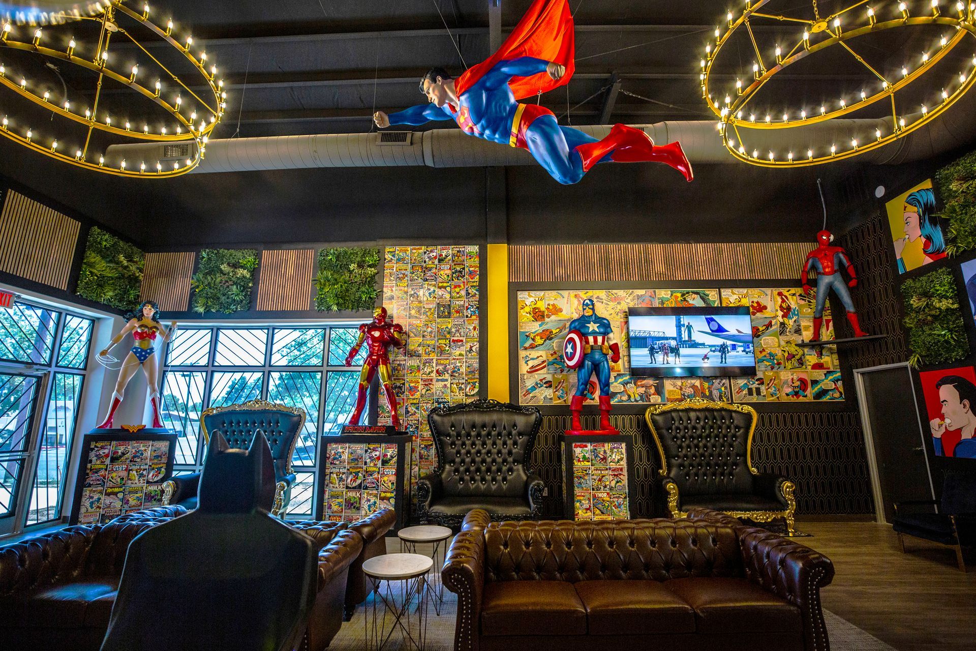 Super Dentists in San Antonio A room with a lot of superhero statues hanging from the ceiling.