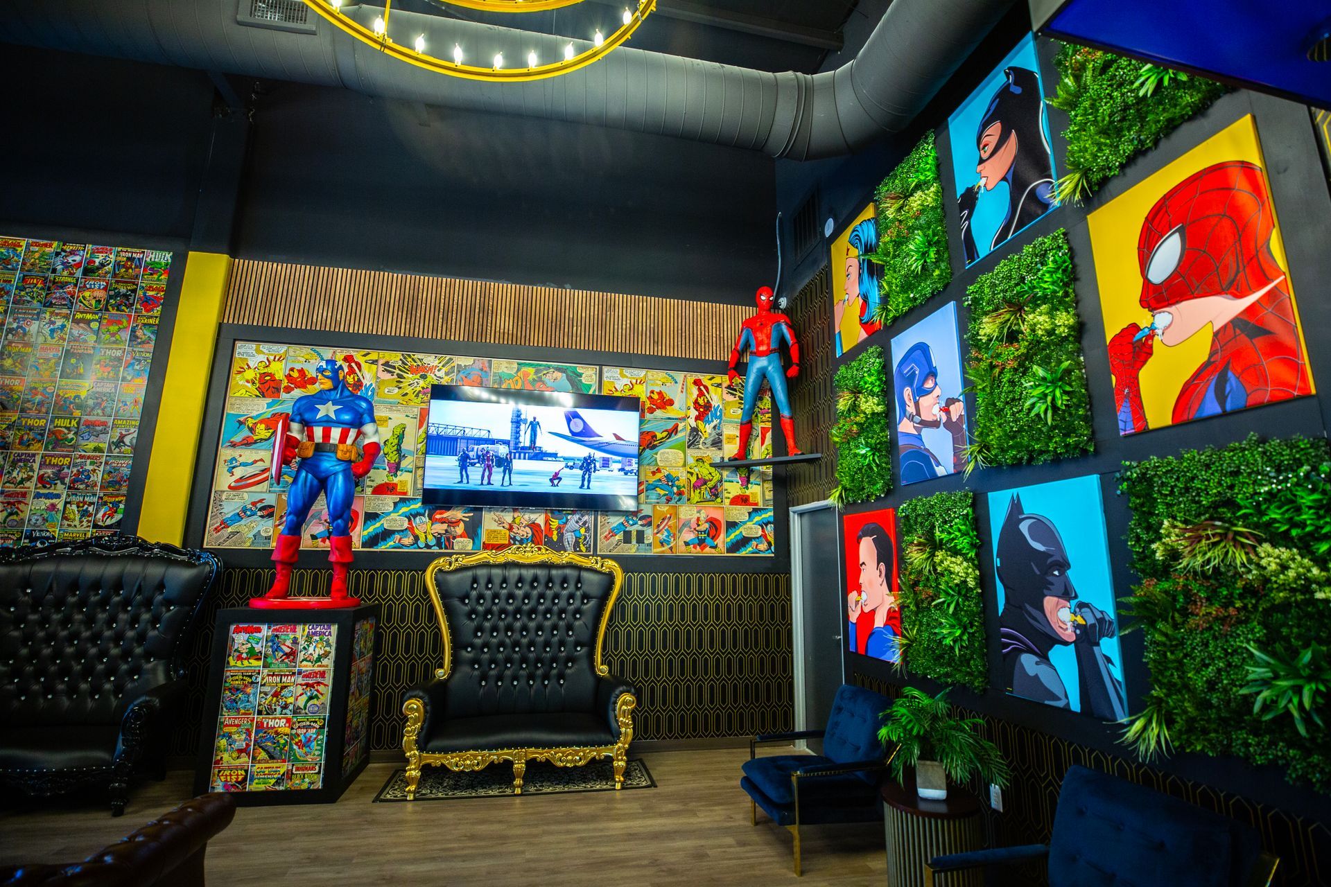 Super Dentists in San Antonio A room with a couch , chairs , and a statue of a superhero on the wall.