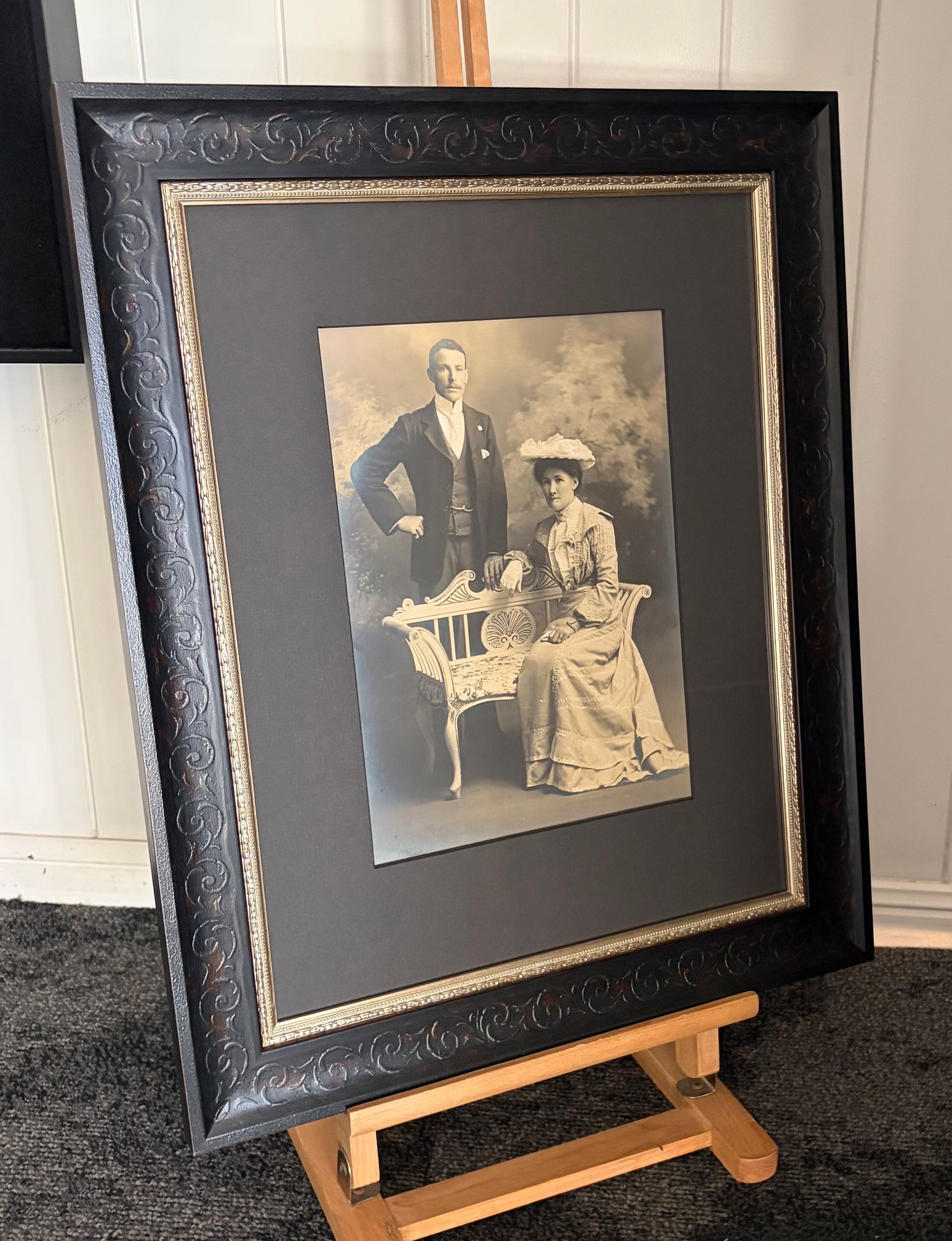 Conservation-framed early 20th century black & white historical photo on an easel