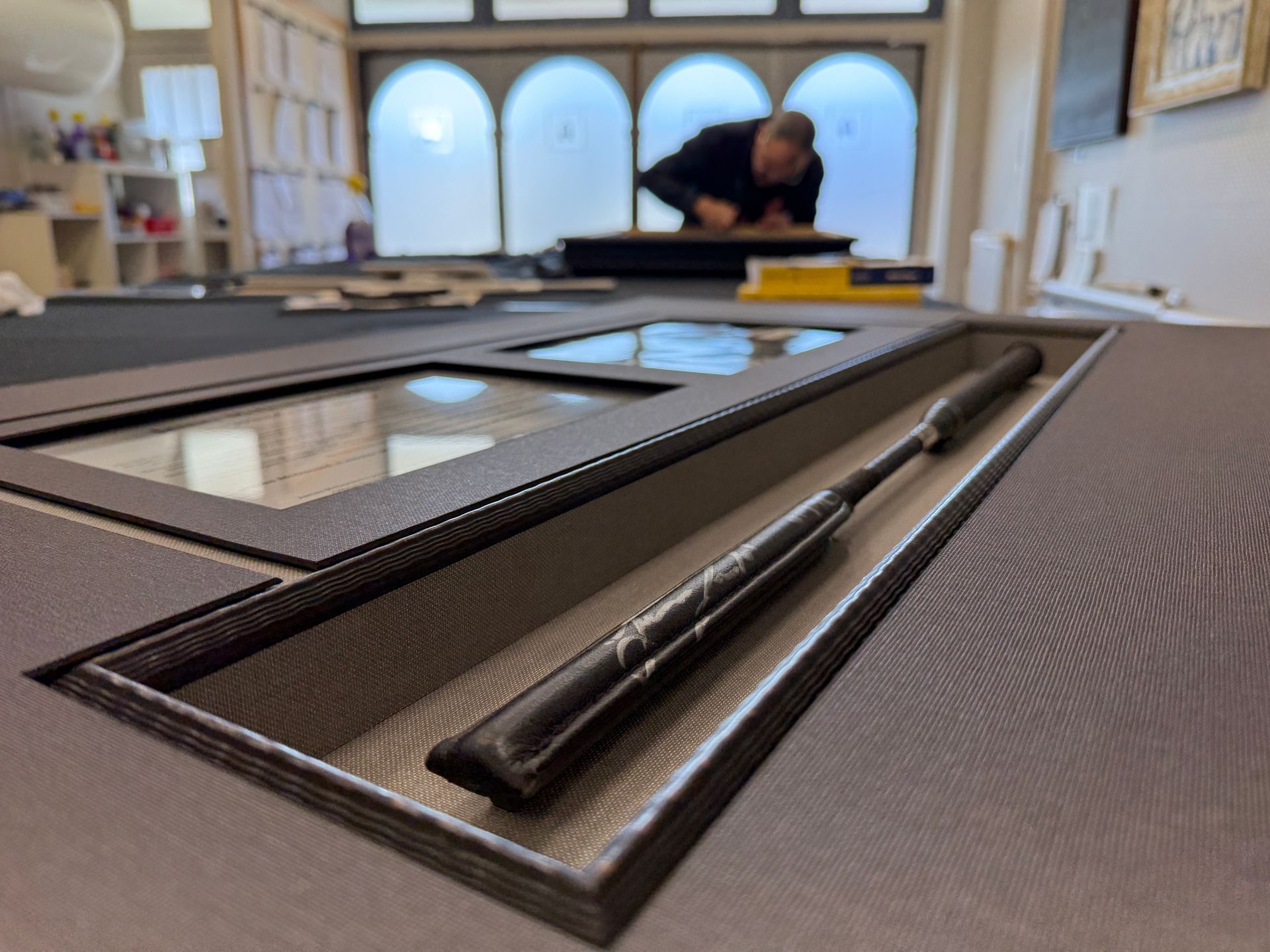 Conservation framing in progress on a signed rider’s crop in the ARTSHOP studio in Toowoomba