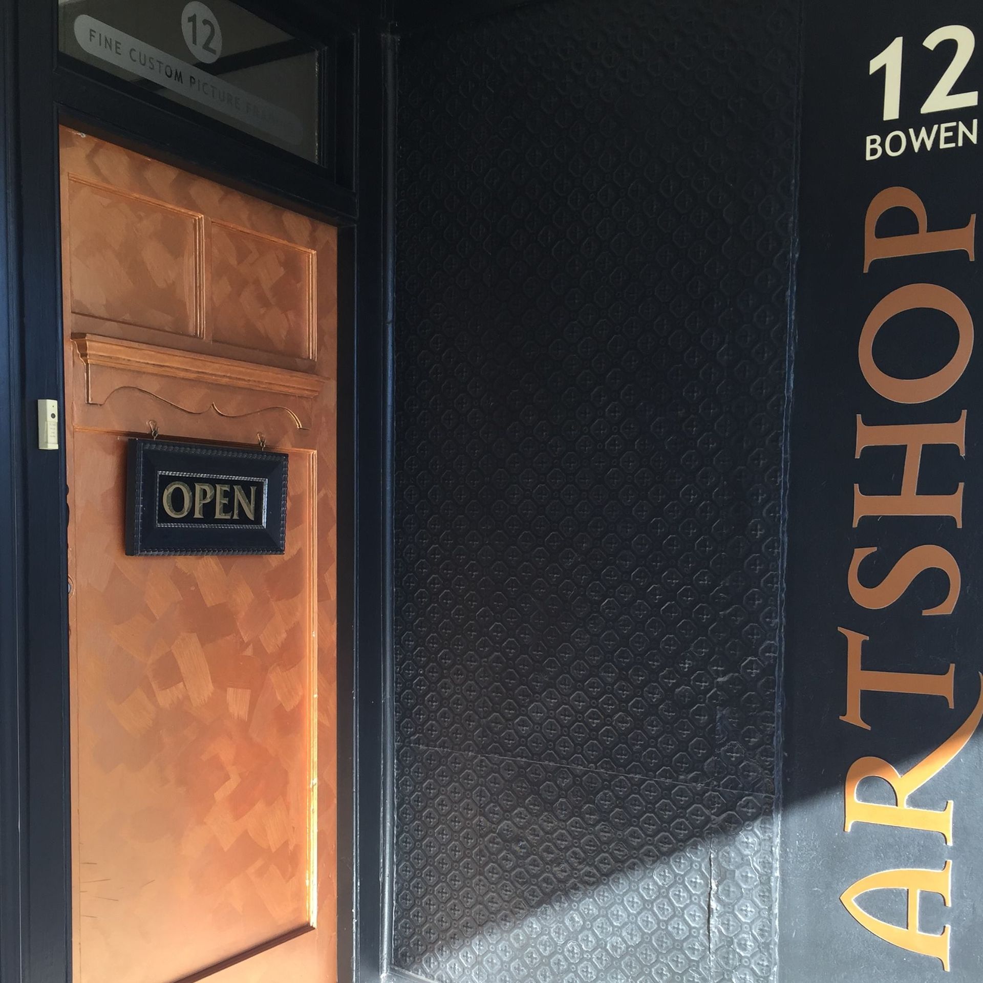 ARTSHOP Toowoomba's bronze front door to its Bowen Street Studio.