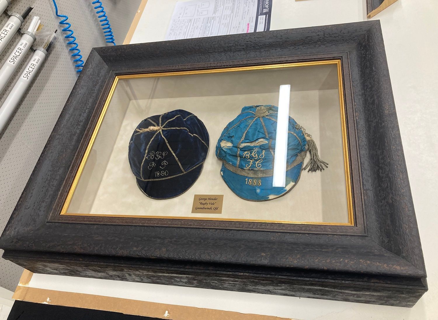 Restored and framed hats family heirloom.