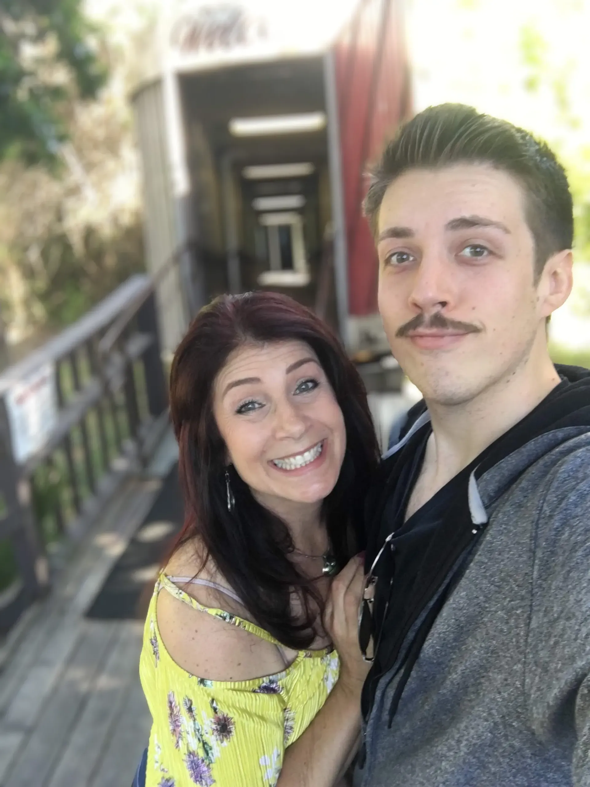 Paula and her son by on a bridge