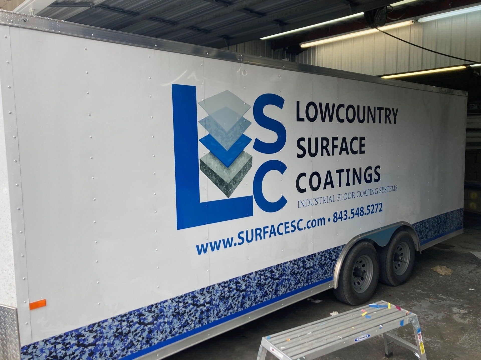 White trailer with blue 