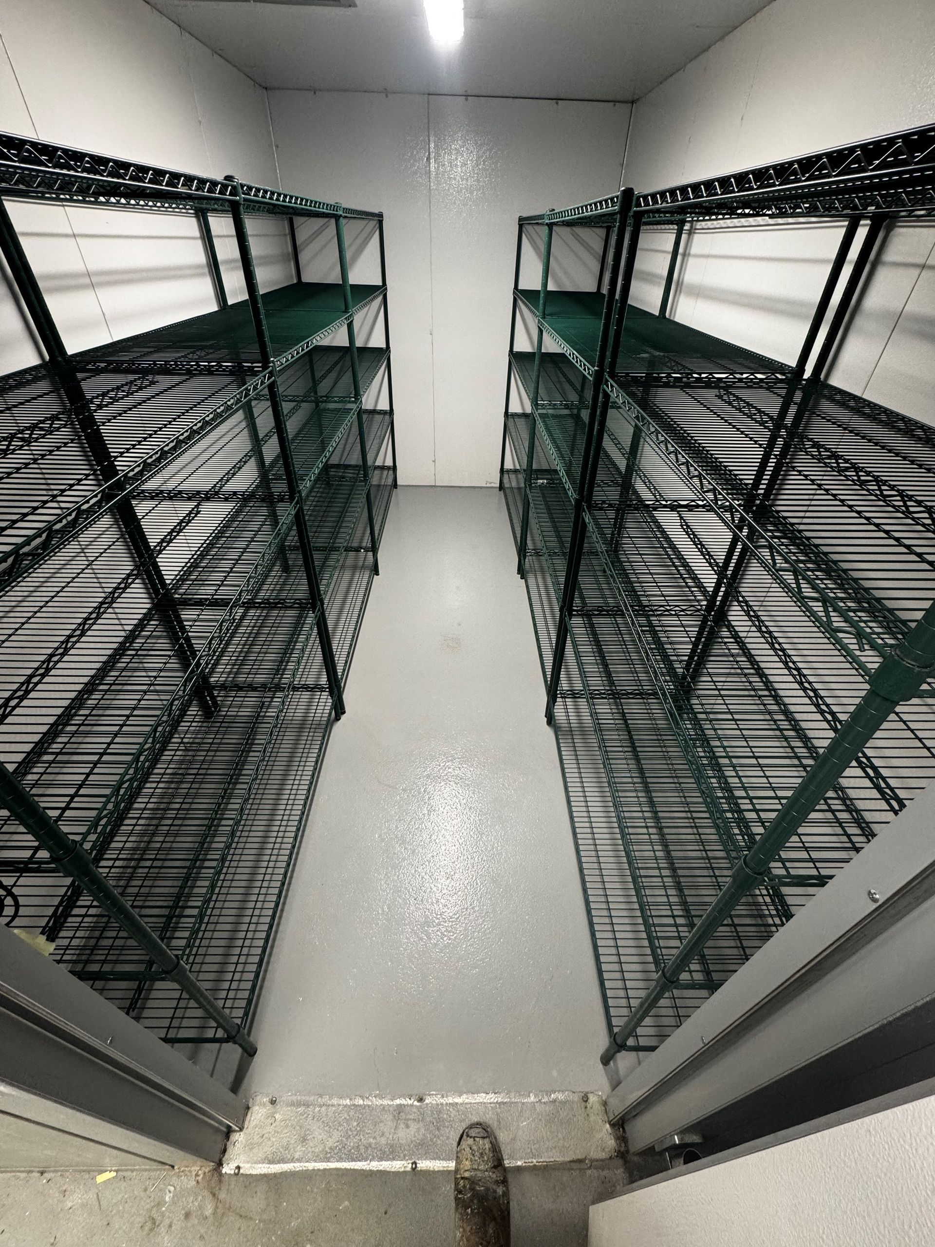 A room filled with lots of shelves and stairs.
