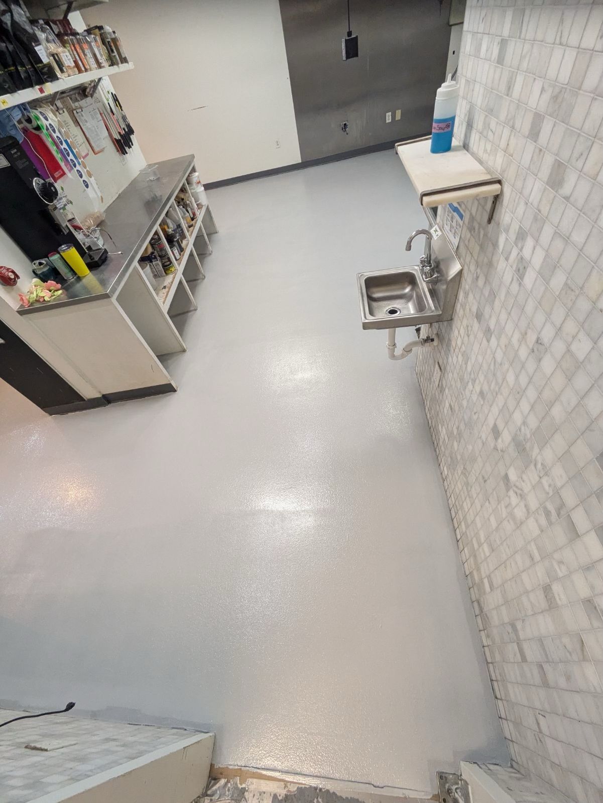 There is a sink in the middle of the room.