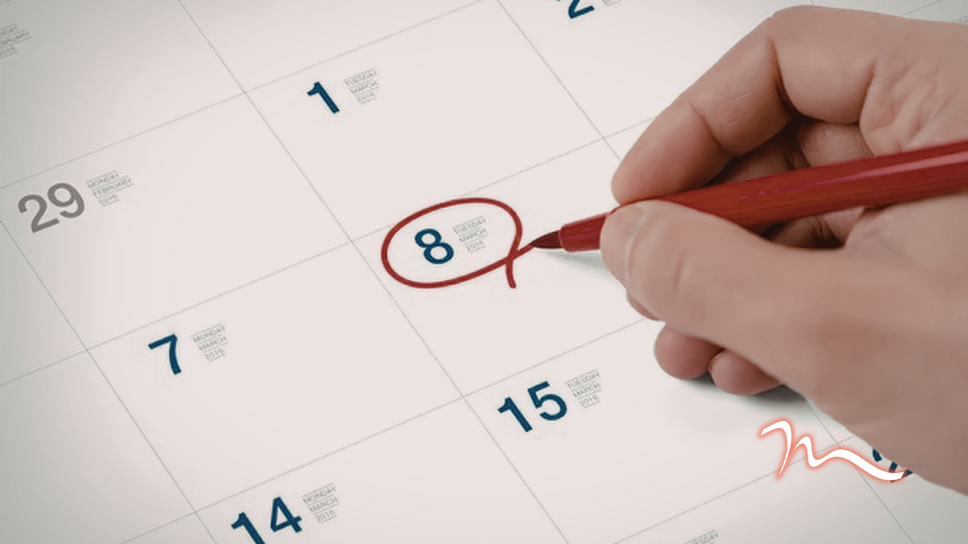 Hand circling the number 8 on a calendar with a red pencil