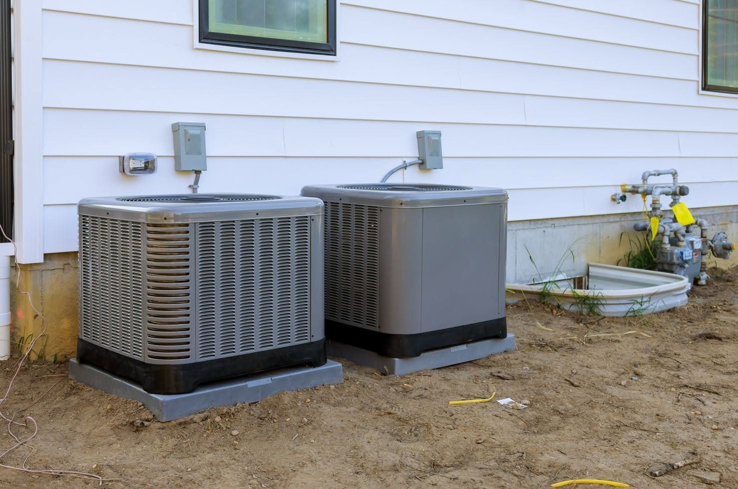 Split system HVAC unit featuring a furnace, indoor coil, and outdoor condenser components for residential heating and cooling.