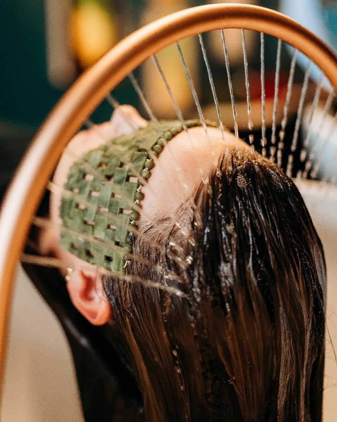 Person Relaxing With a Green Facial Mask While a Stream of Water Sprays — Air Hair Studio in Toowoomba City, QLD