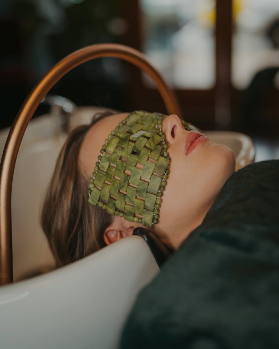 Person Reclining in a Bathtub With a Green Woven Eye Mask — Air Hair Studio in Toowoomba City, QLD