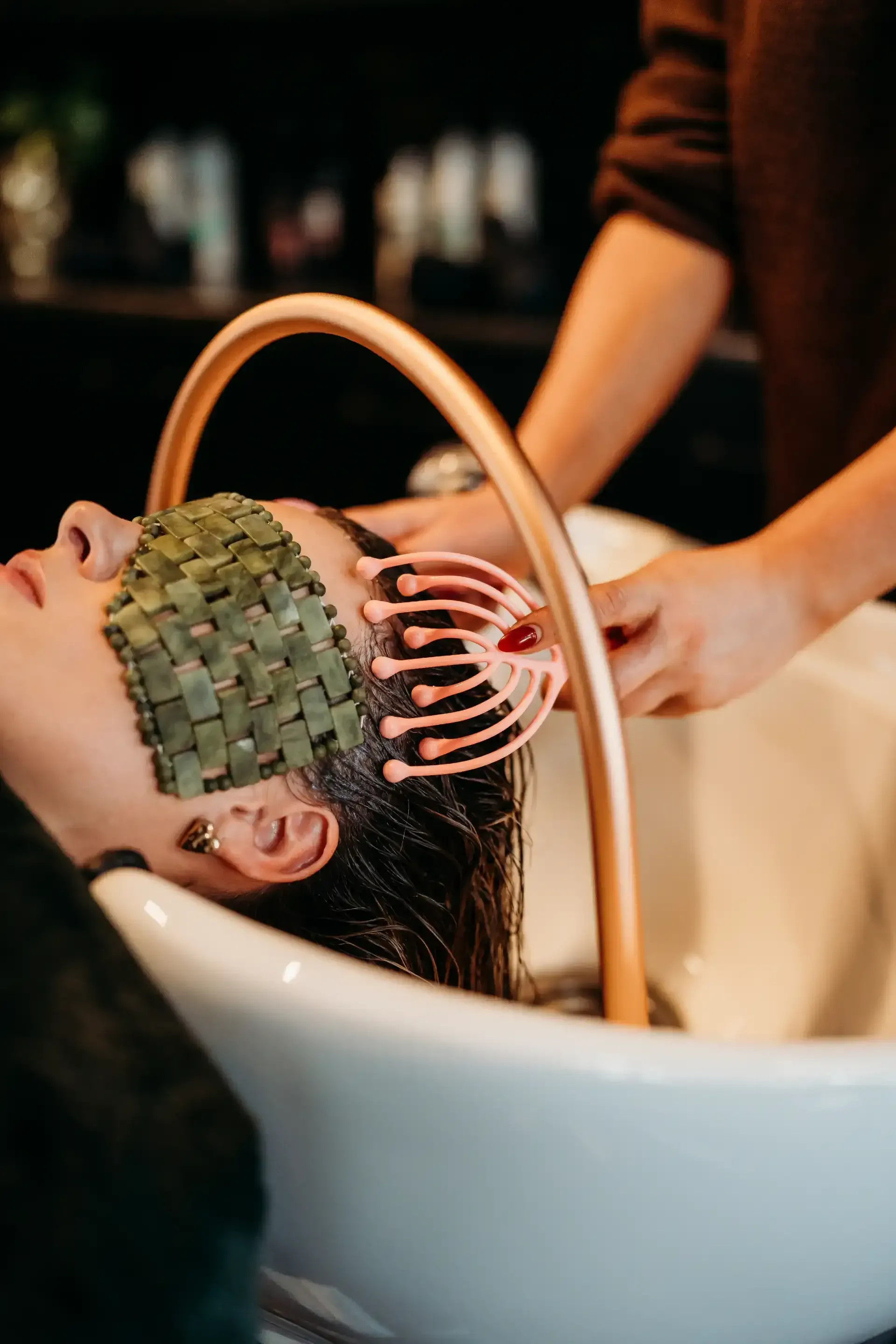 A Woman is Getting Her Hair Washed in a Sink at a Salon  — Air Hair Studio in Toowoomba City, QLD